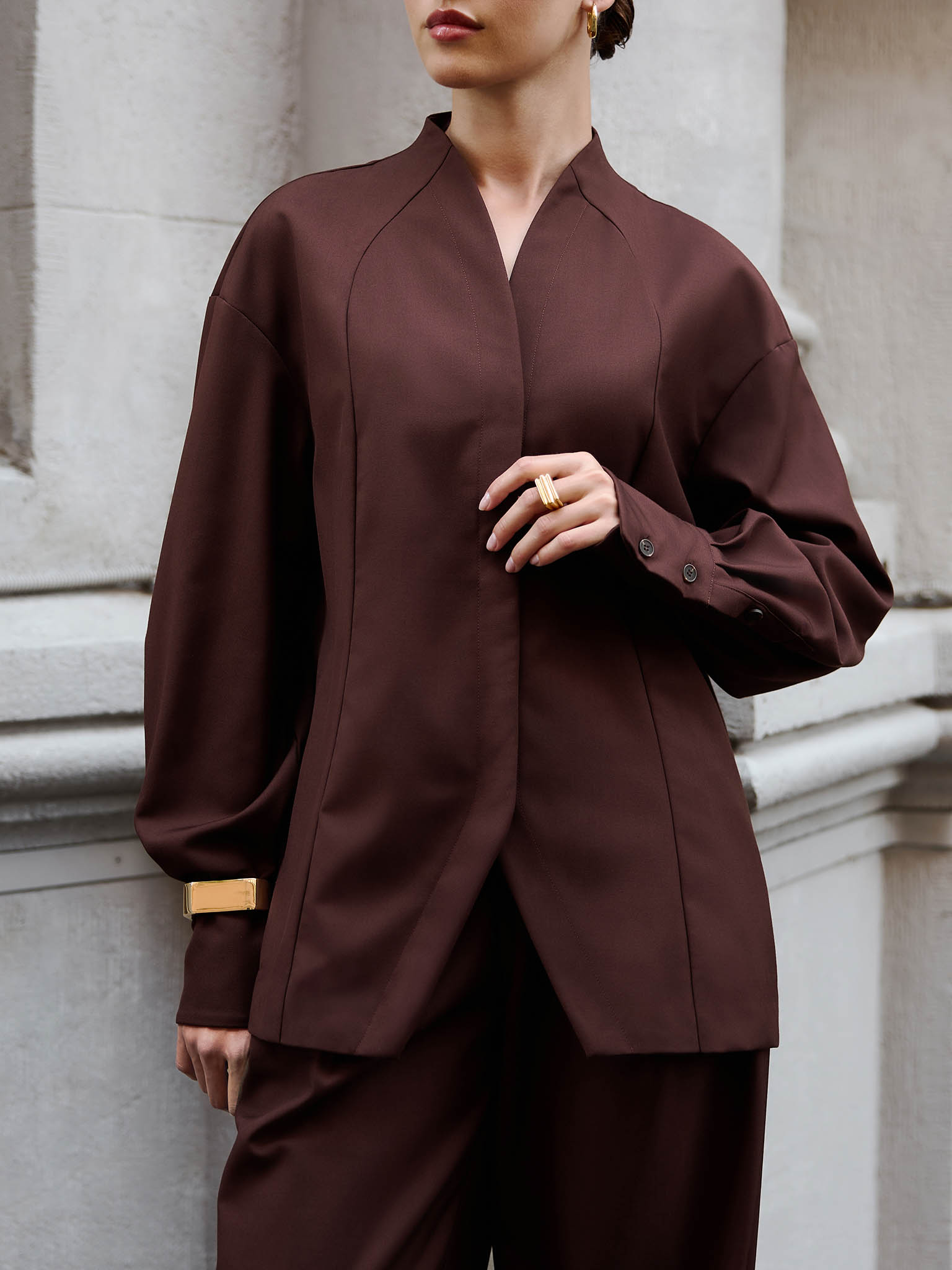 Complex cut shirt with hidden button fastening