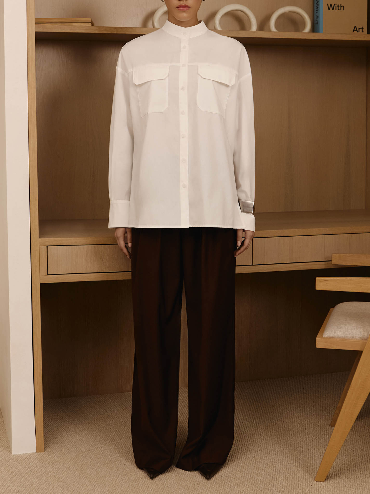 Loose trousers with waist pleats and eco-leather belt 