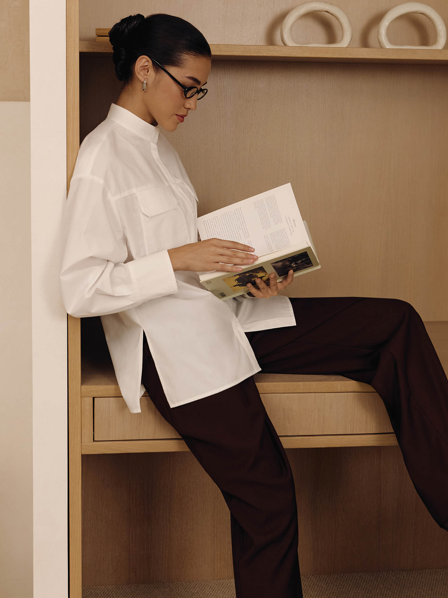 Loose trousers with waist pleats and eco-leather belt 