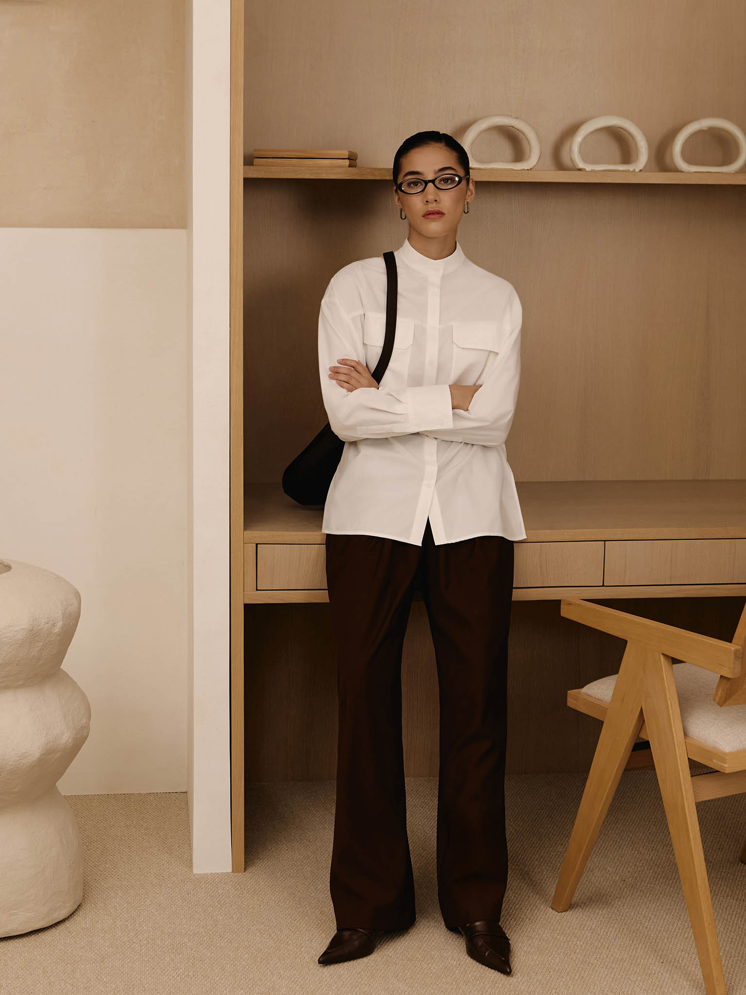 Loose trousers with waist pleats and eco-leather belt 