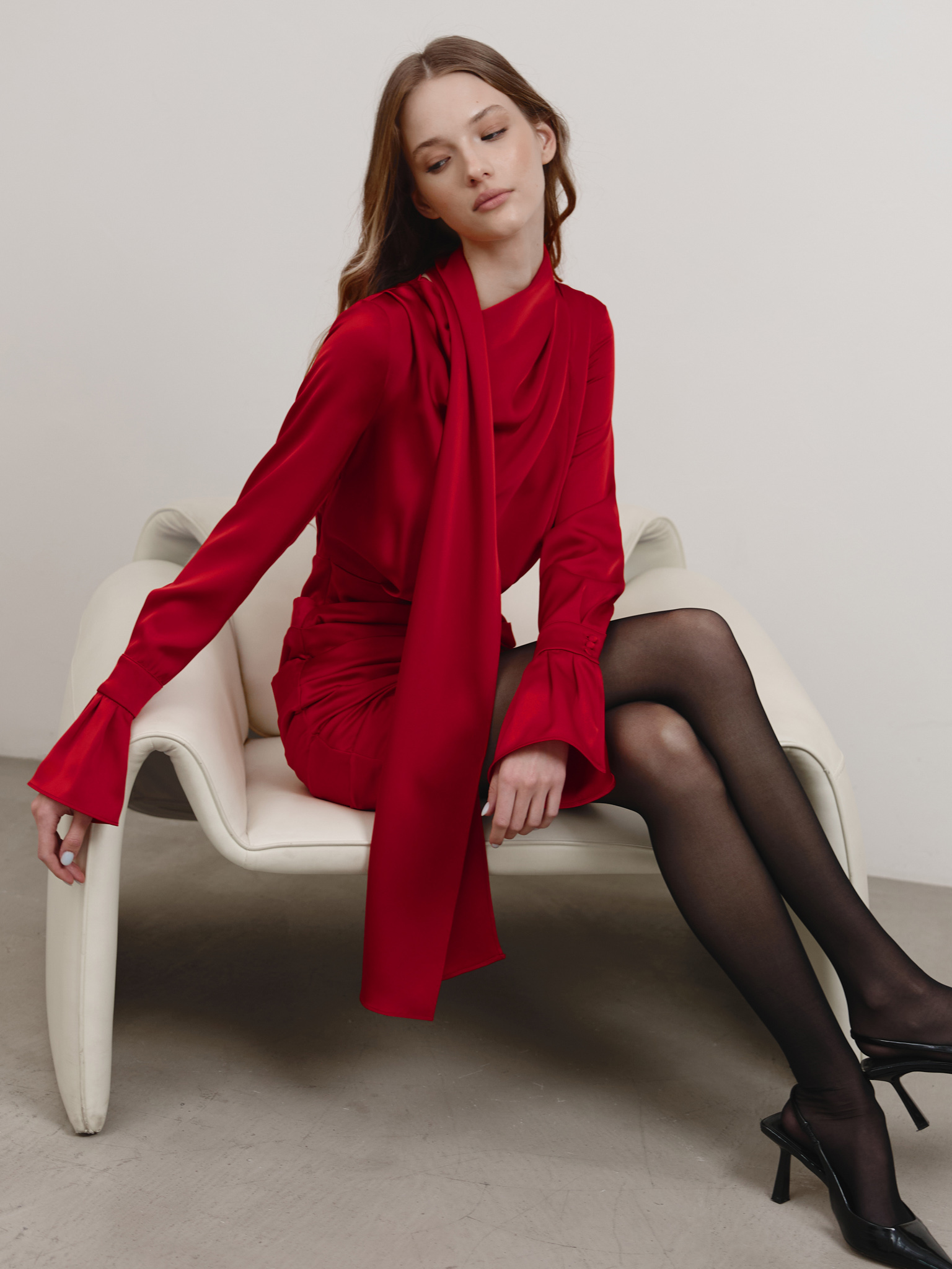 Flowing mini dress with a decorative scarf