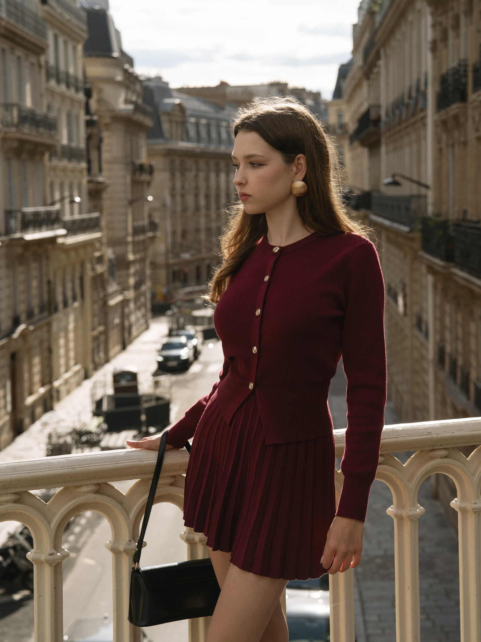 Knitted cardigan with golden buttons