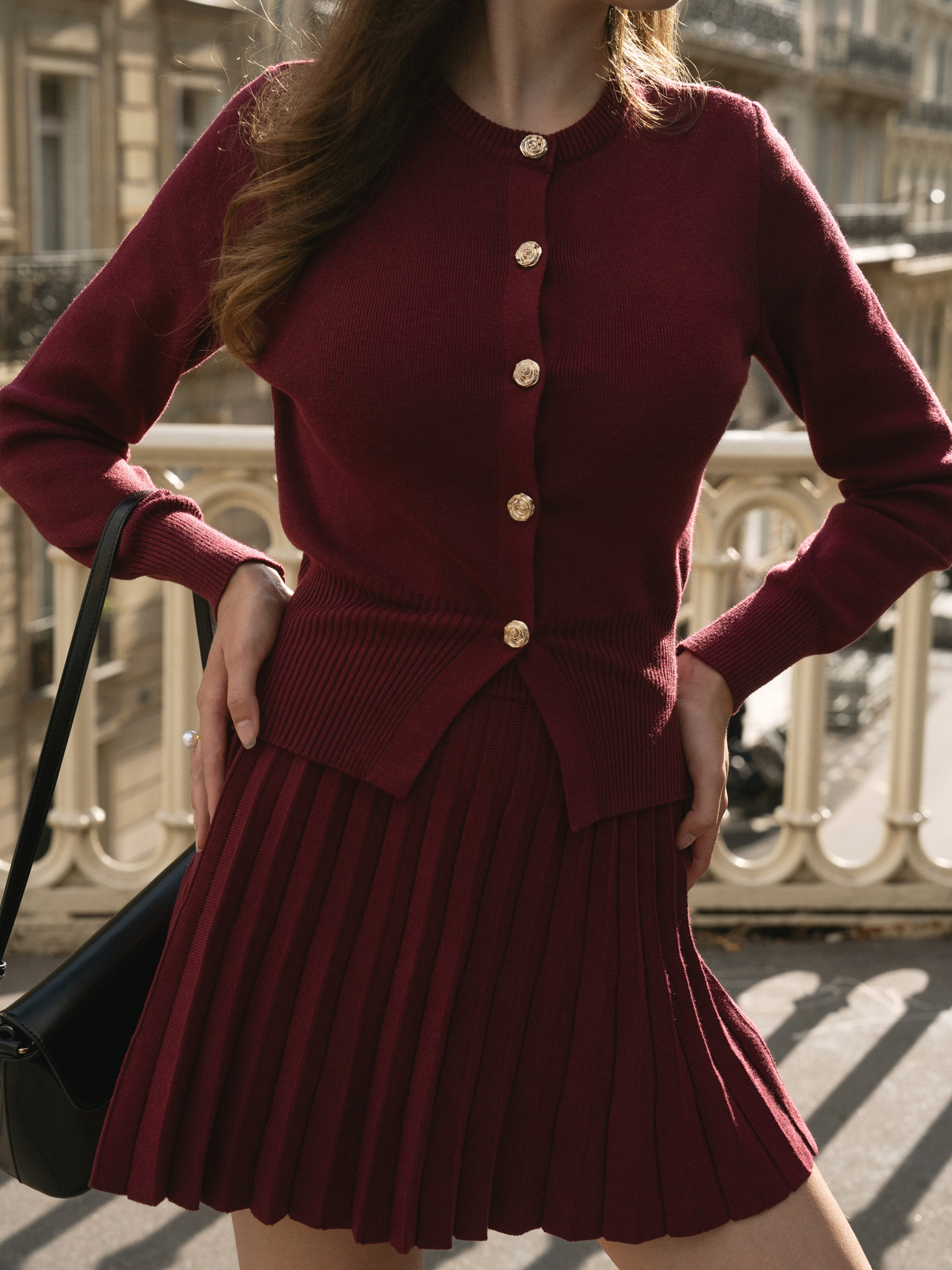 Knitted cardigan with golden buttons