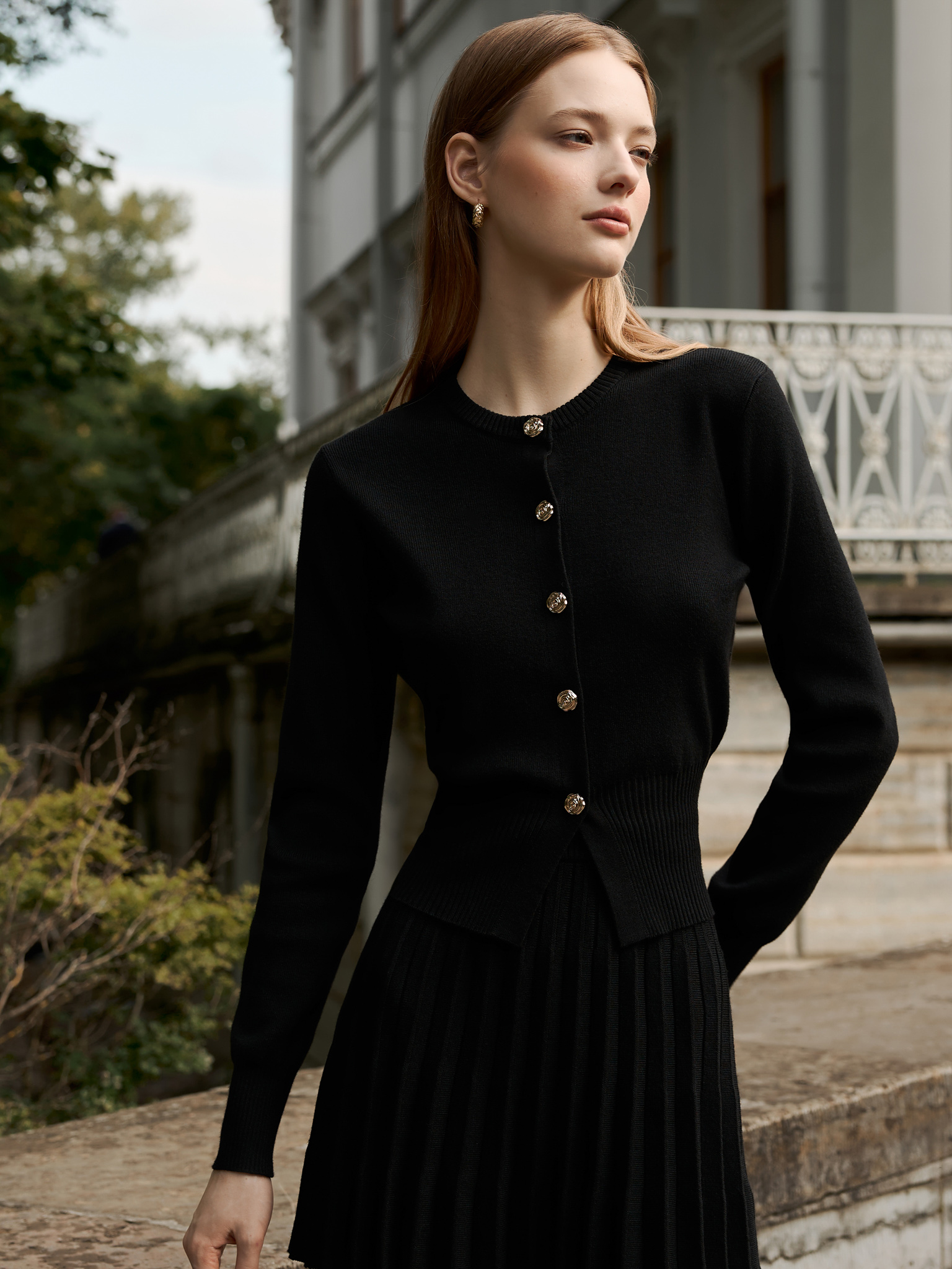 Knitted cardigan with golden buttons