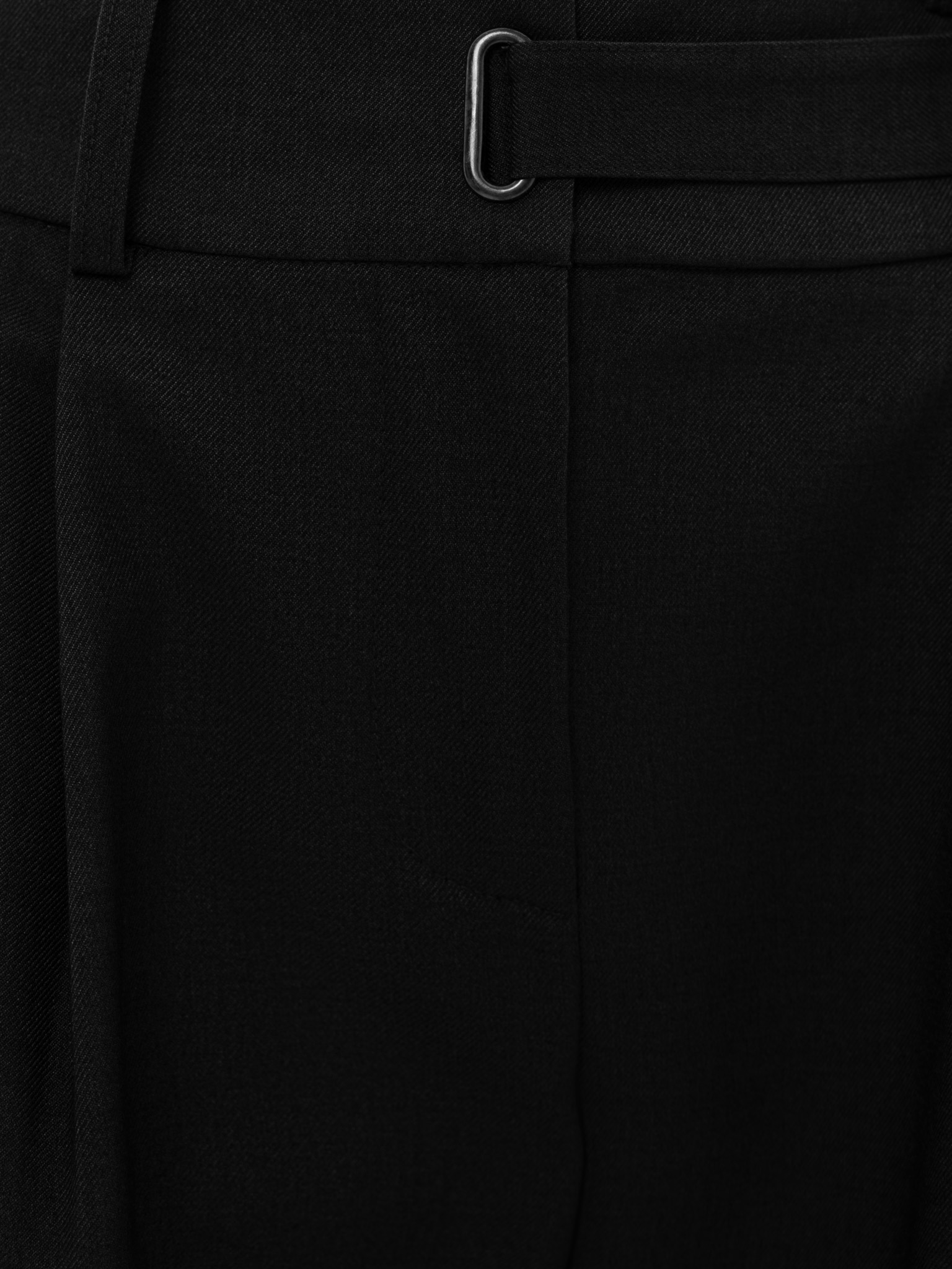 Loose trousers with snap at the waist