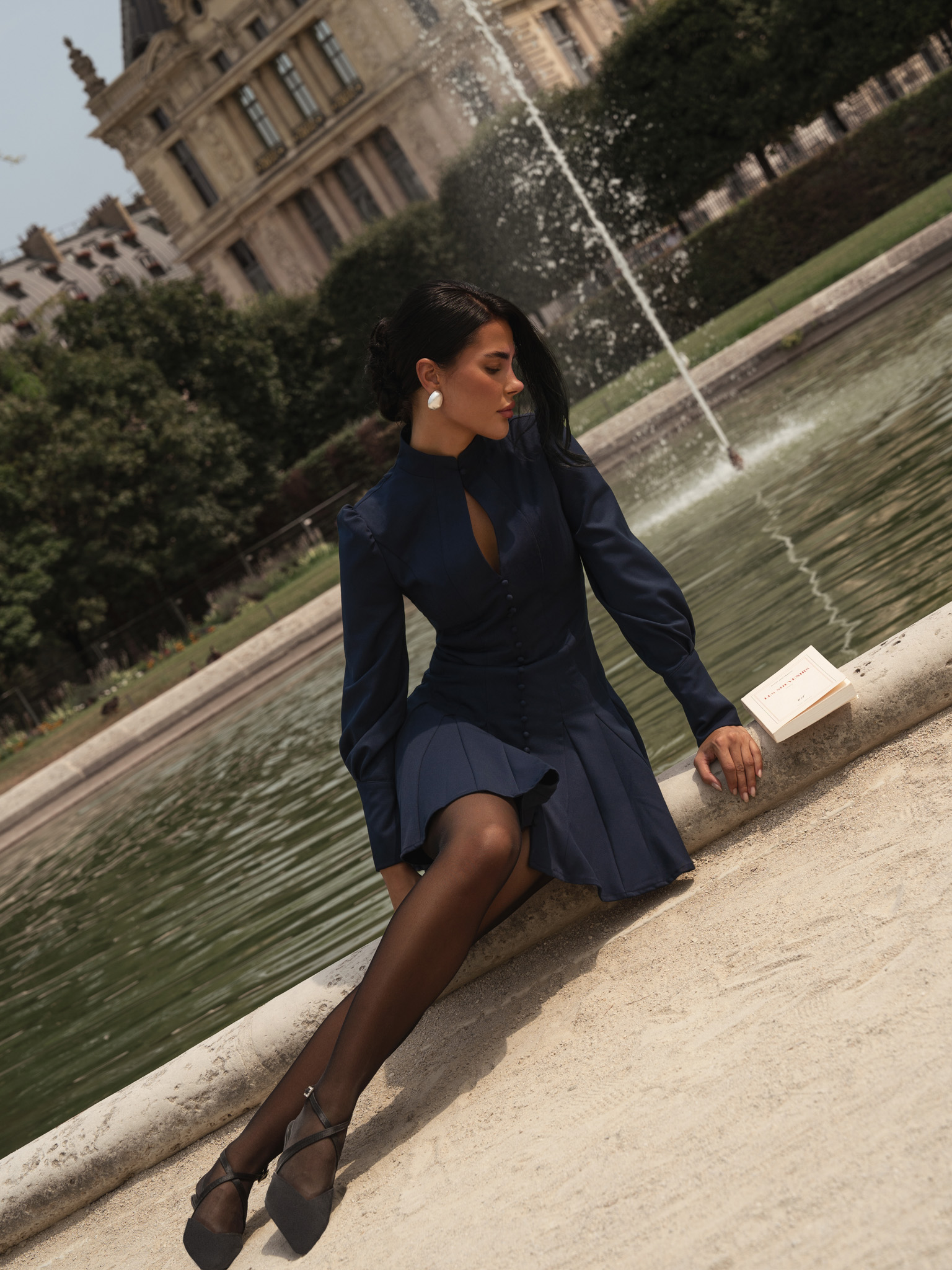 Fitted mini dress with shaped neckline and small buttons