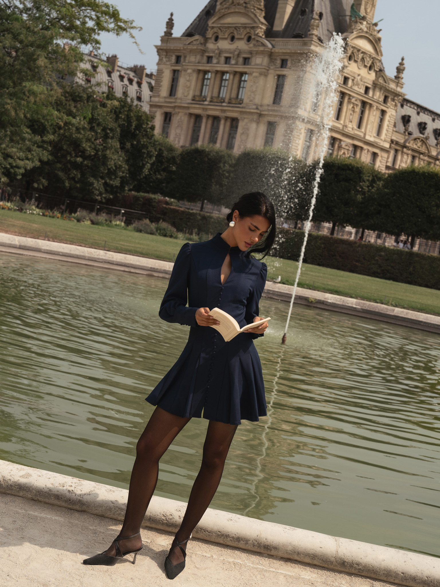 Fitted mini dress with shaped neckline and small buttons