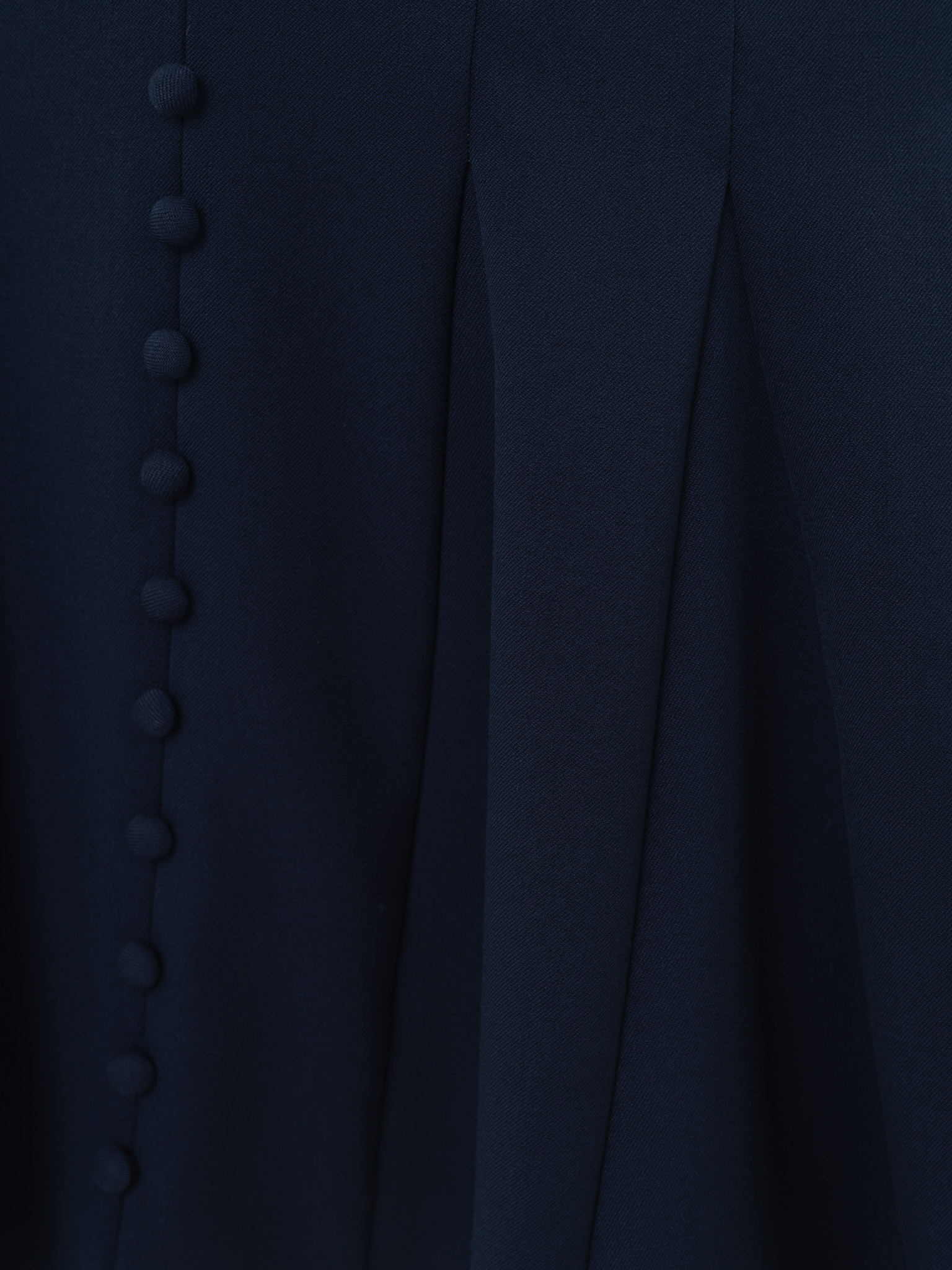 Fitted mini dress with shaped neckline and small buttons