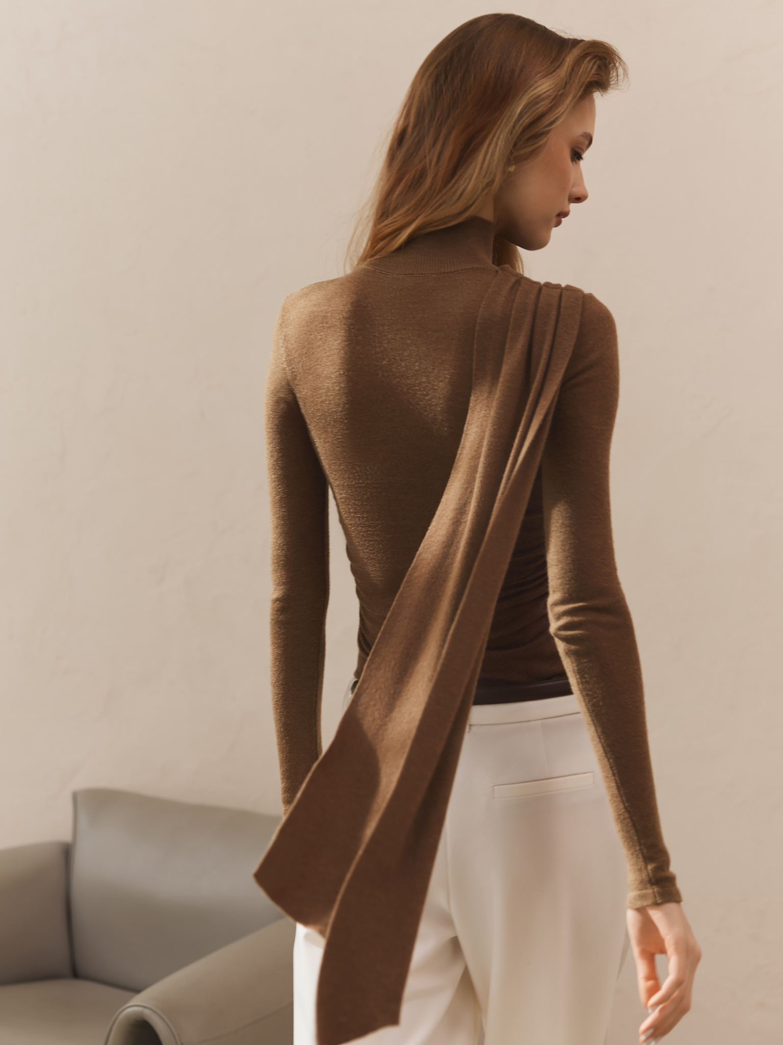 Turtleneck with diagonal drapery on the shoulder
