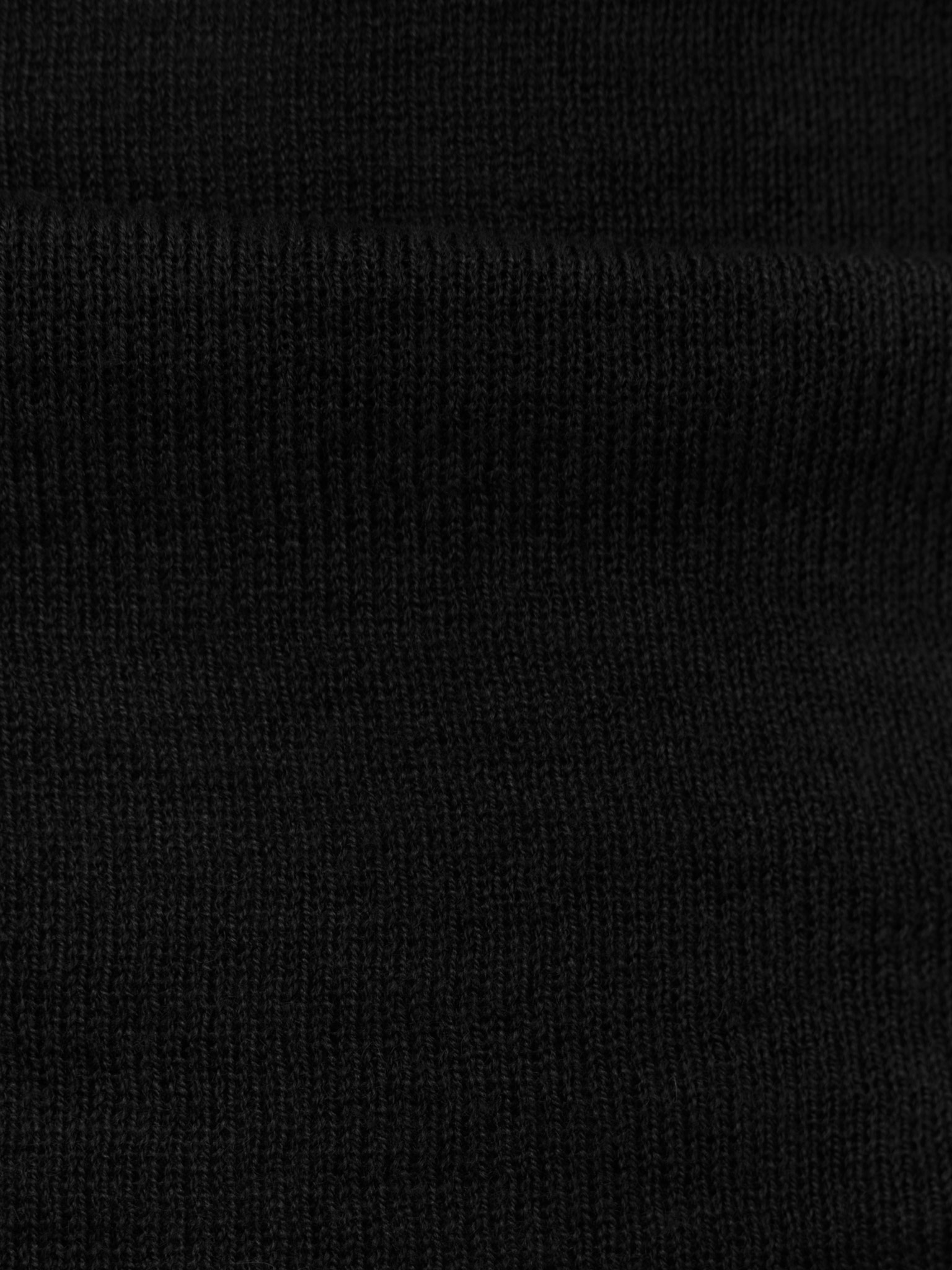 Turtleneck with diagonal drapery on the shoulder