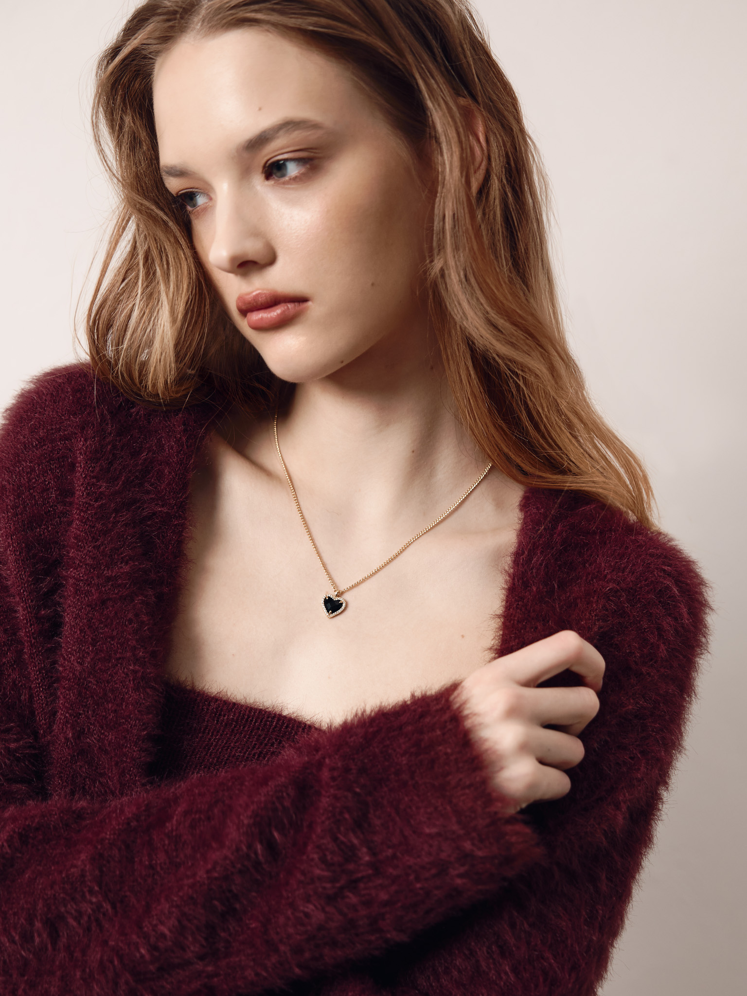 Golden chain with heart-shaped pendant