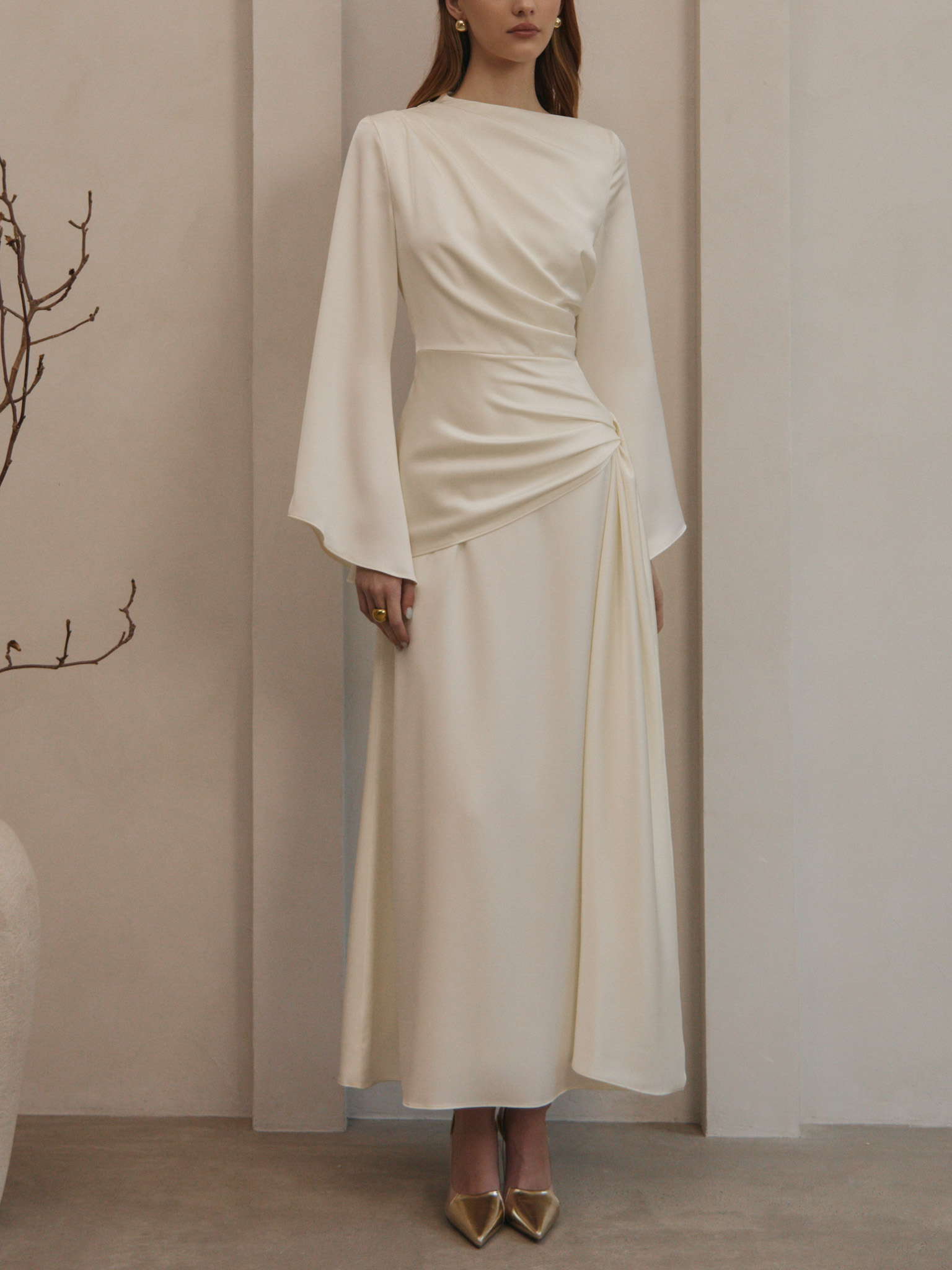 Maxi satin dress with long sleeves and asymmetrical draping