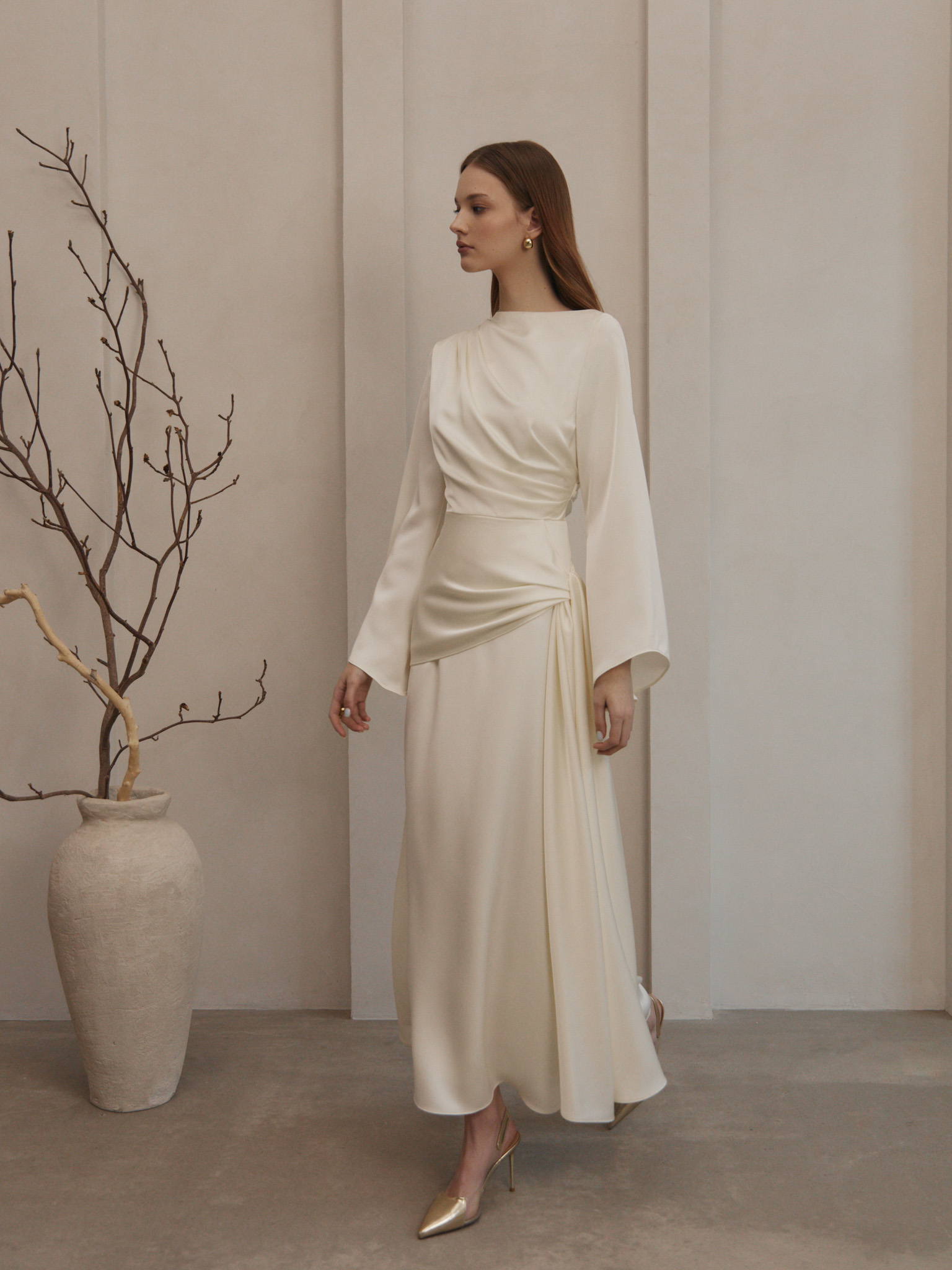Maxi satin dress with long sleeves and asymmetrical draping