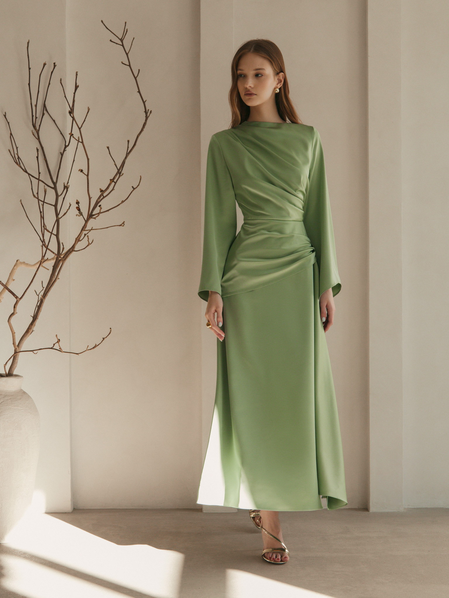 Maxi satin dress with long sleeves and asymmetrical draping