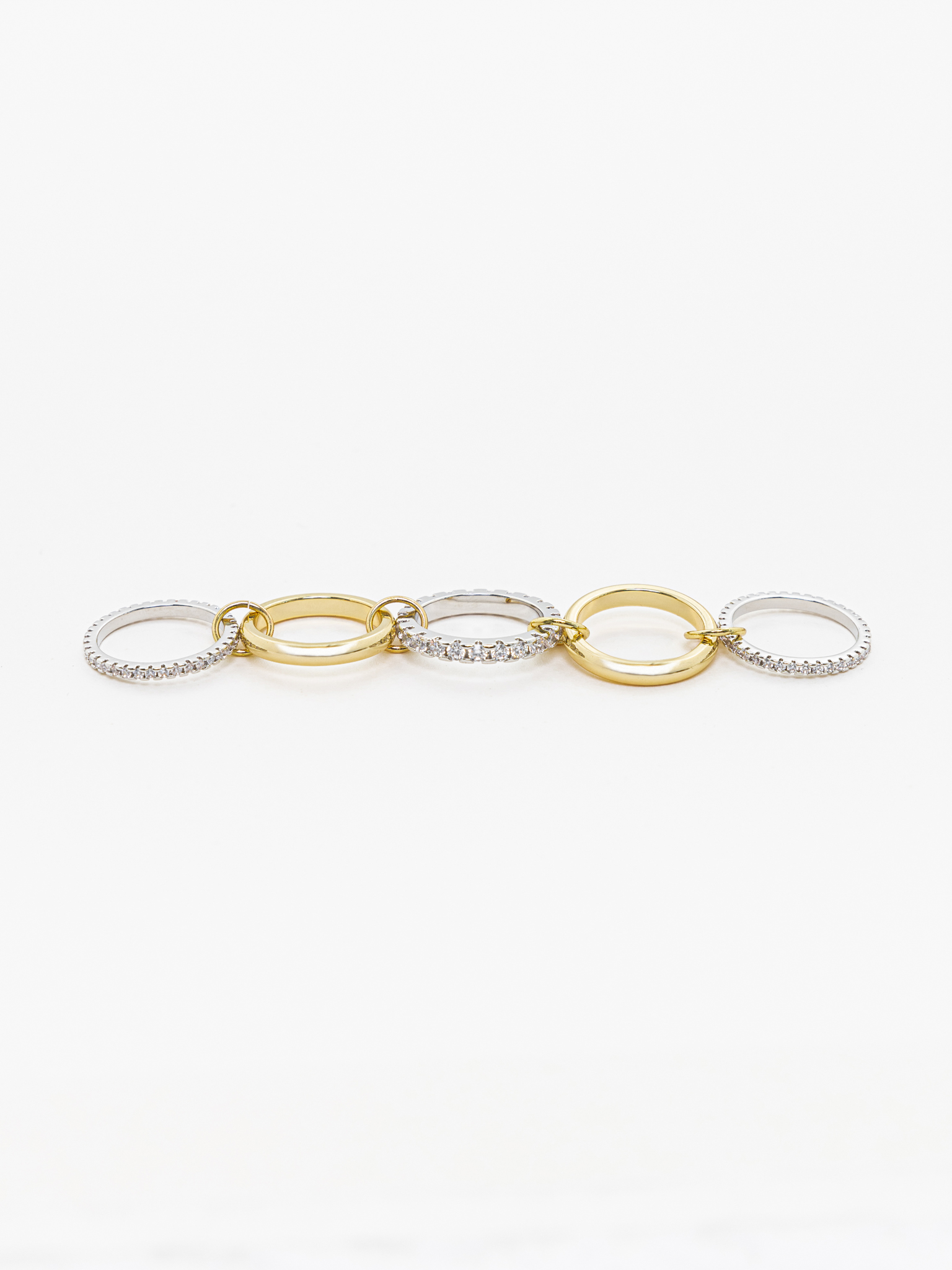 Многослойное кольцо из двух металлов со стразовым декором