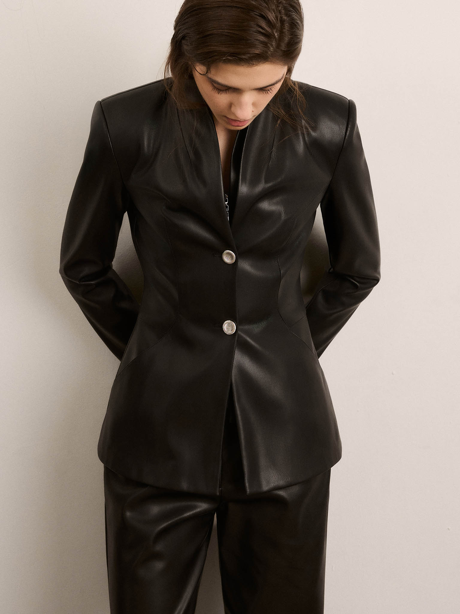 Fitted eco-leather jacket with contrasting buttons