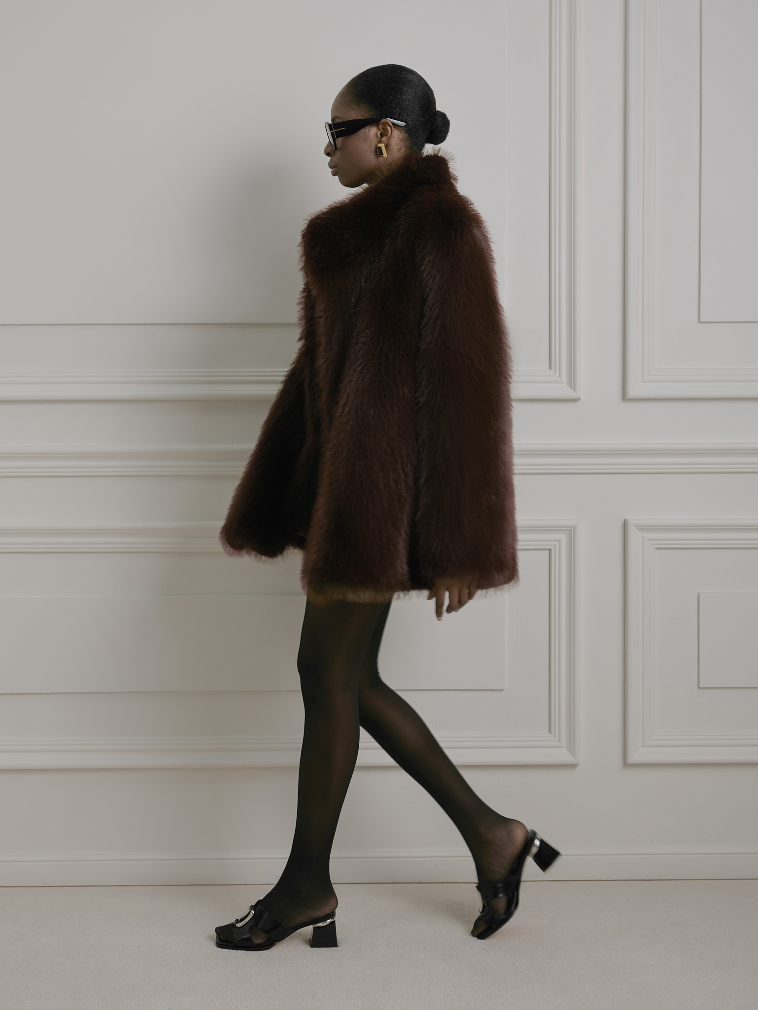 Short loose-fitting eco-fur coat with stand-up collar