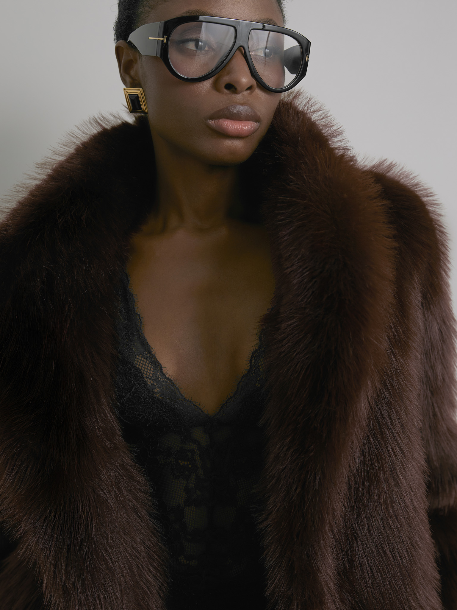 Short loose-fitting eco-fur coat with stand-up collar