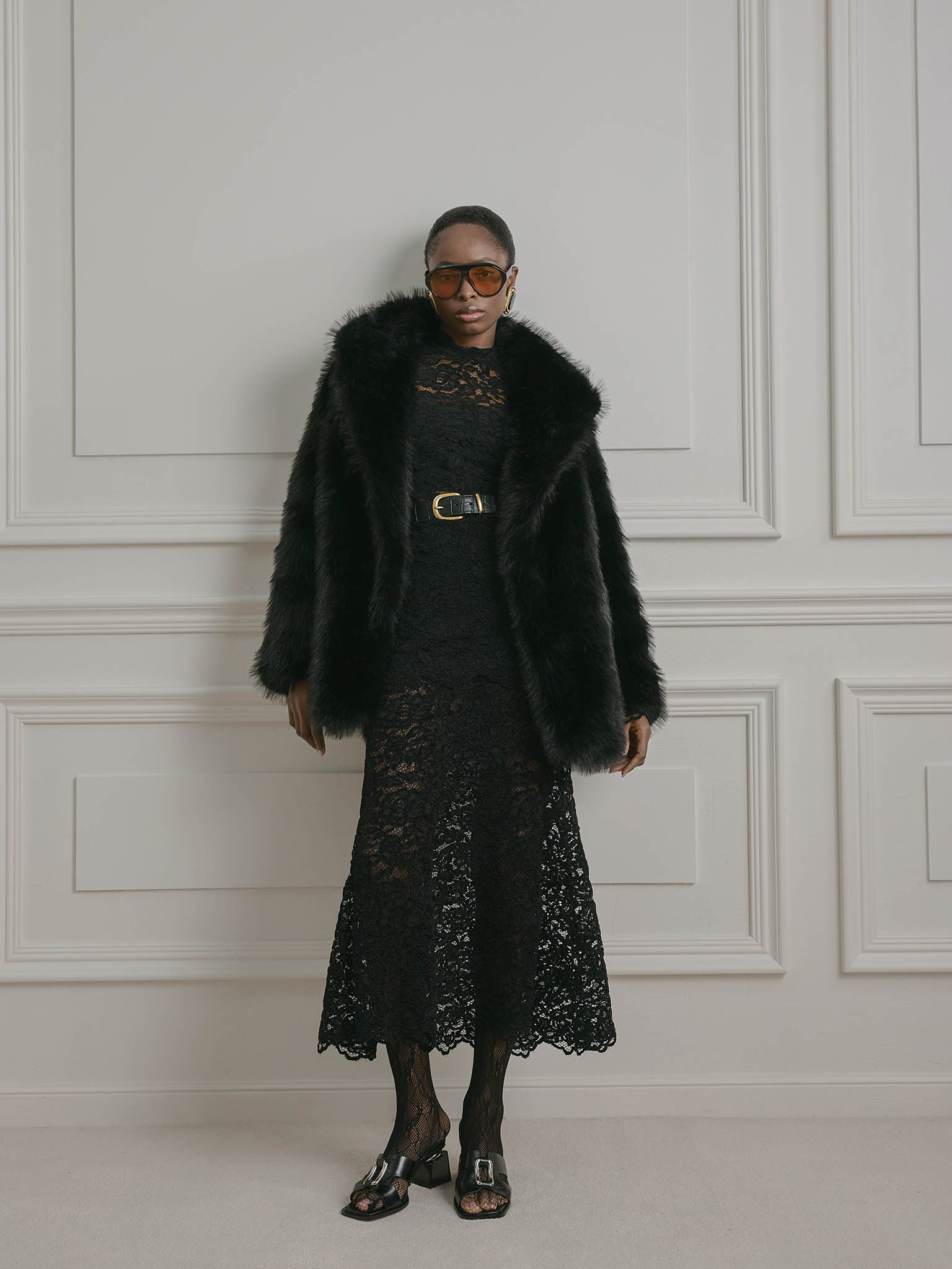 Short loose-fitting eco-fur coat with stand-up collar
