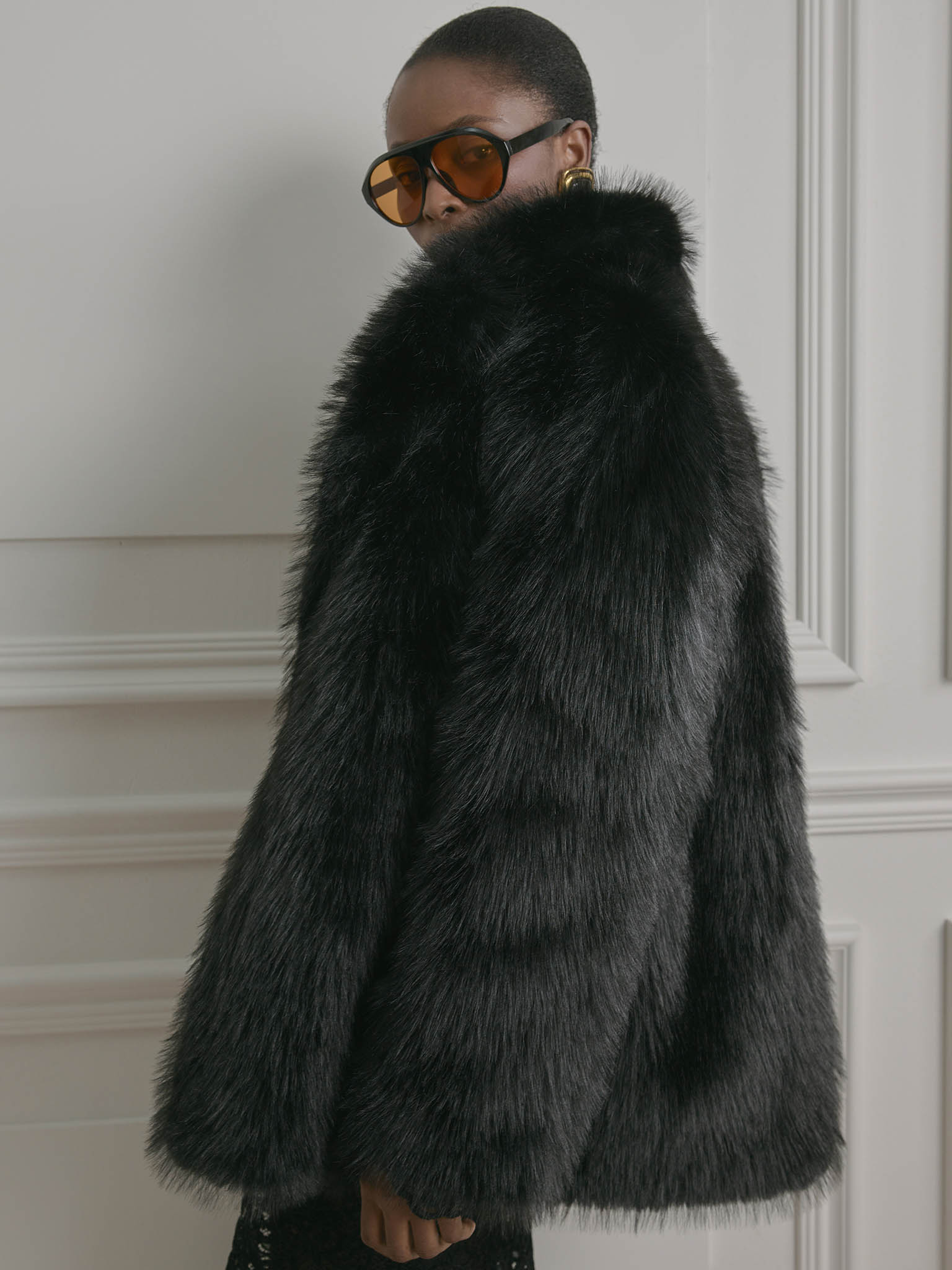 Short loose-fitting eco-fur coat with stand-up collar