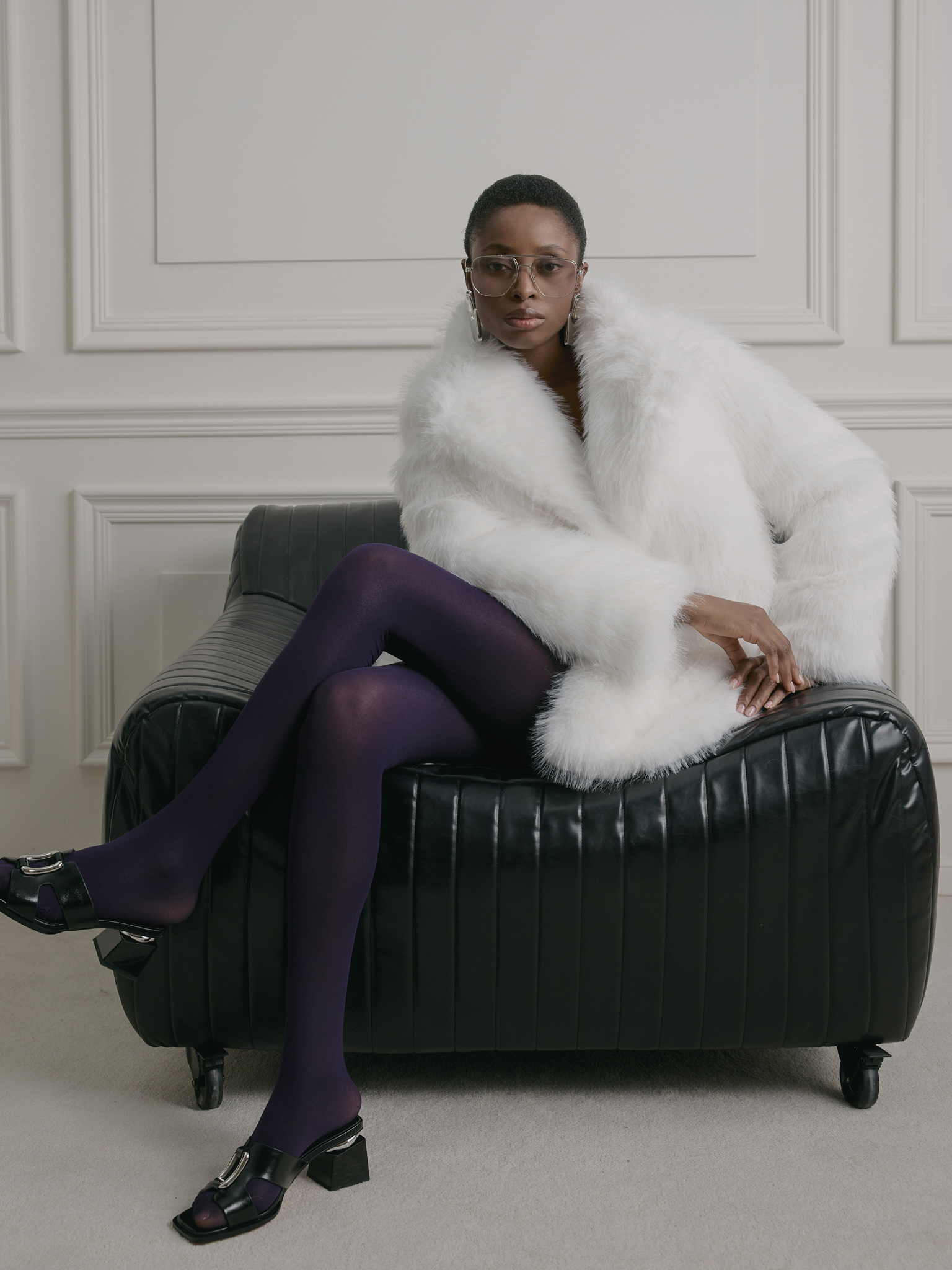 Short loose-fitting eco-fur coat with stand-up collar