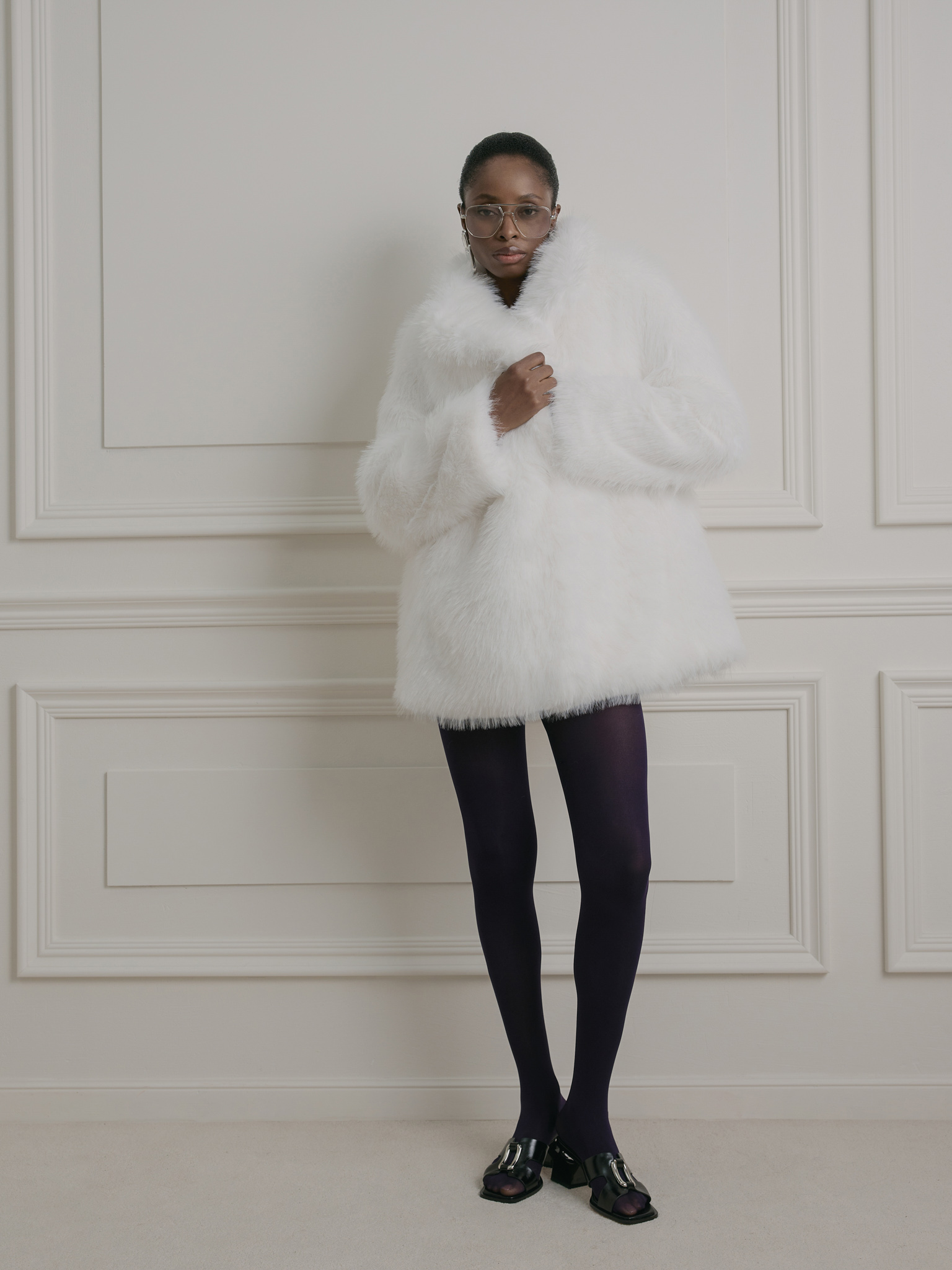 Short loose-fitting eco-fur coat with stand-up collar