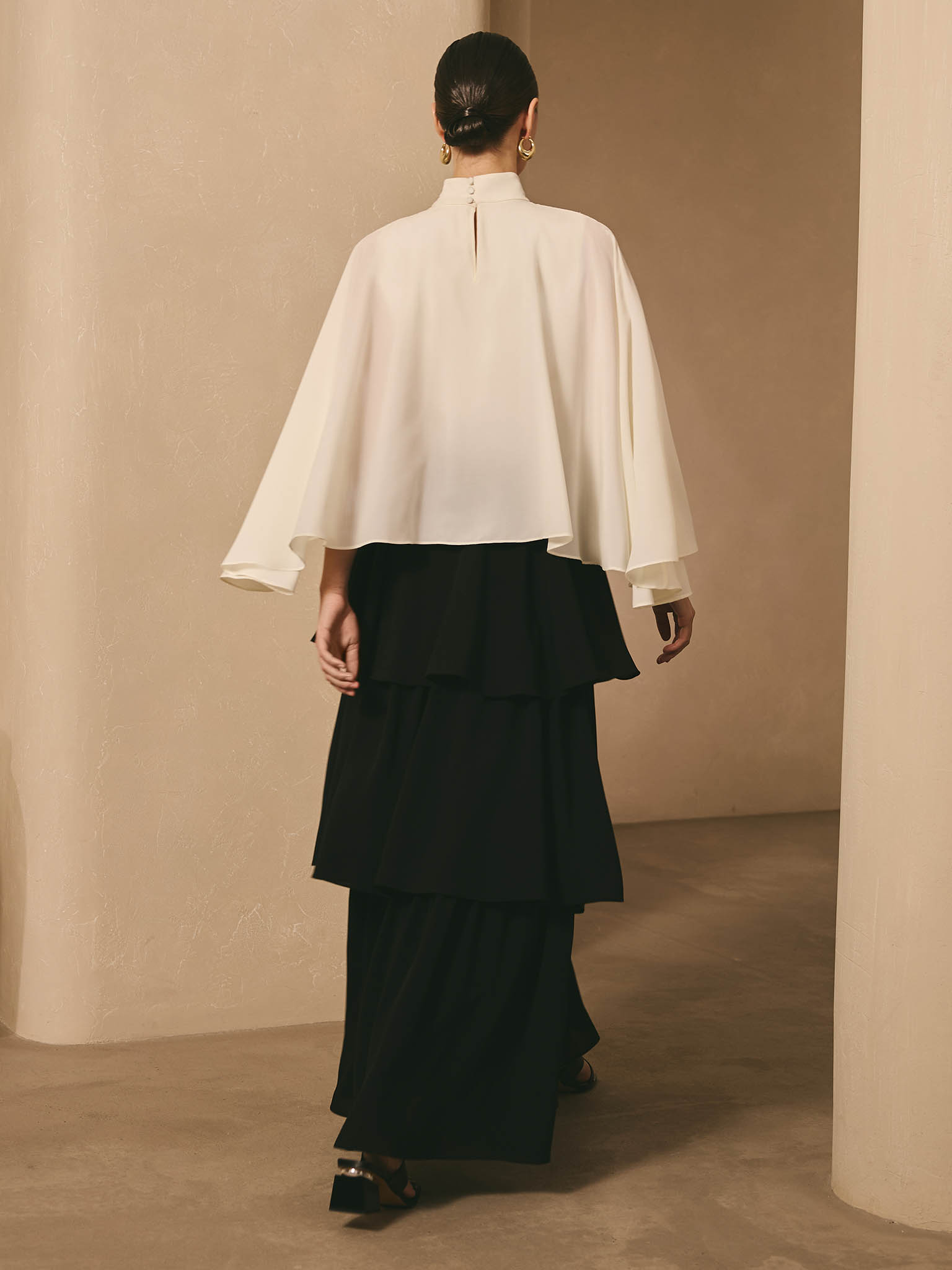Maxi dress with contrasting cape and tiered skirt