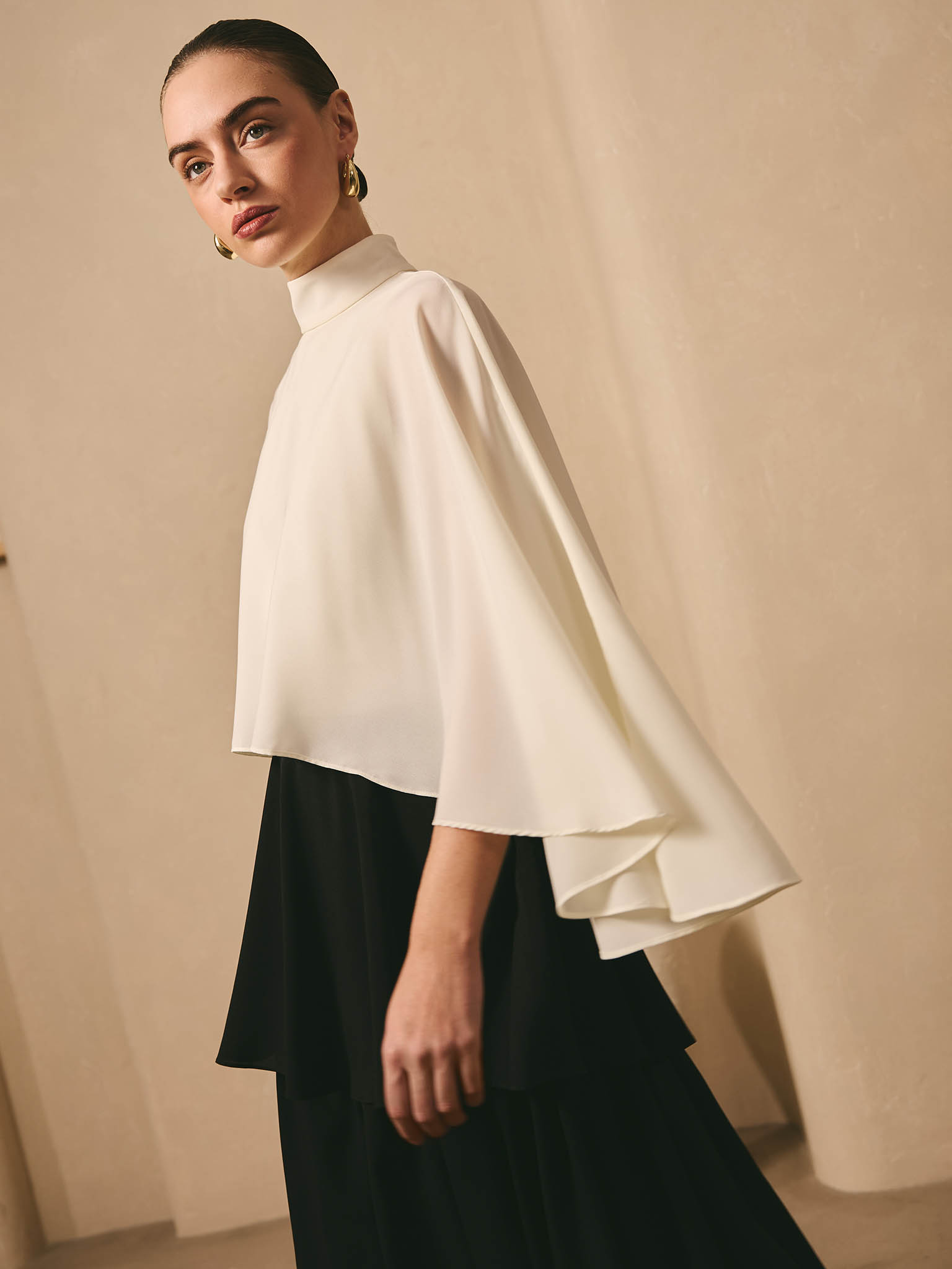 Maxi dress with contrasting cape and tiered skirt