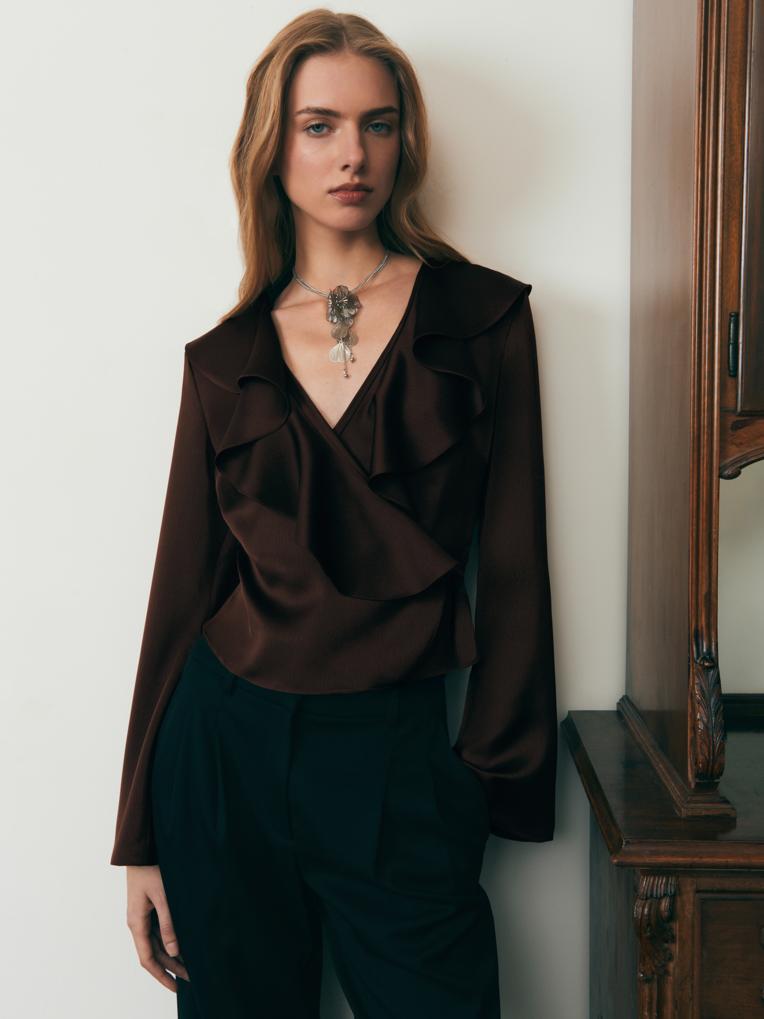 Wrap-around satin blouse with ruffles on the collar