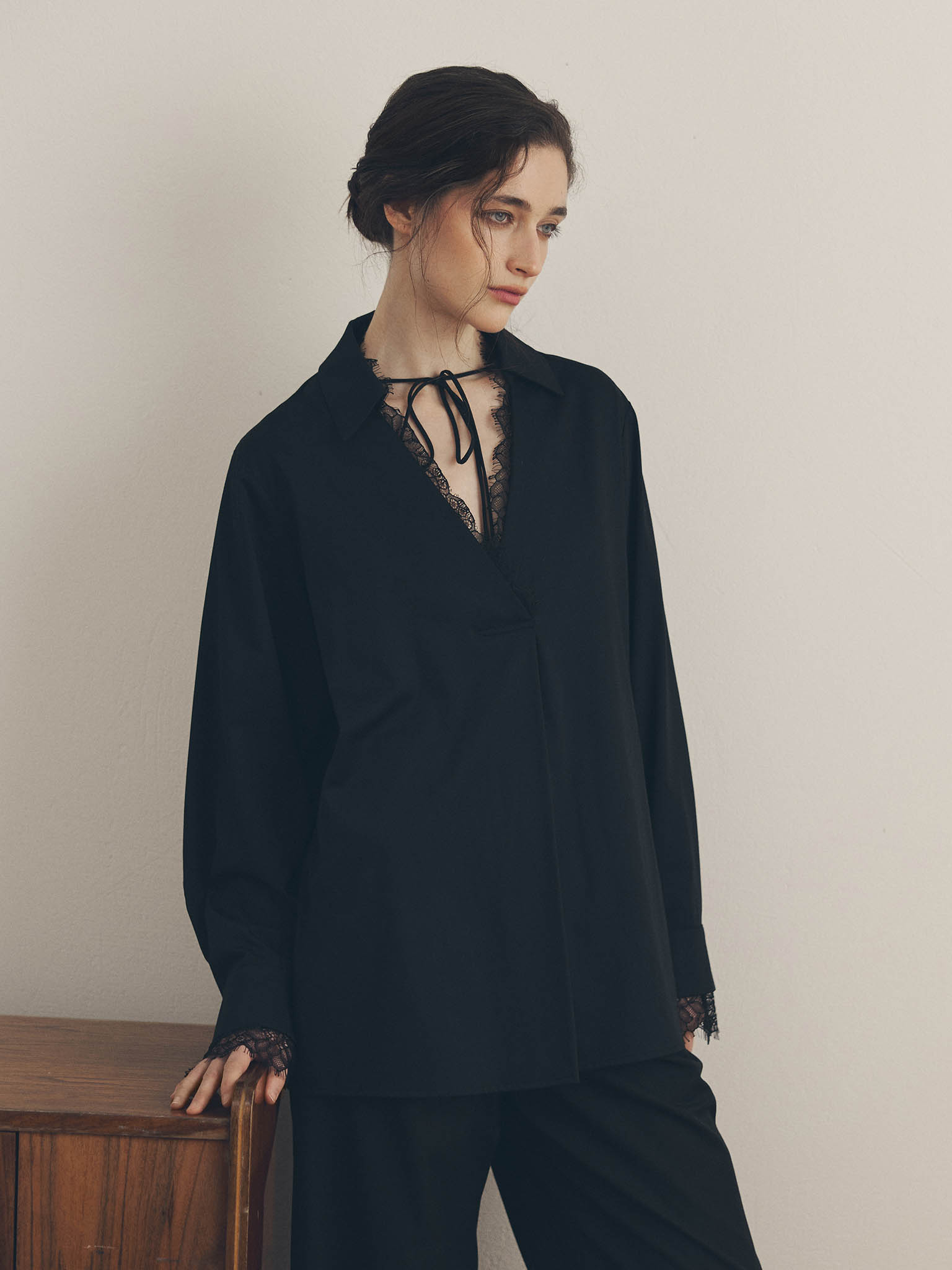 Blouse with lace trim and ties at the collar