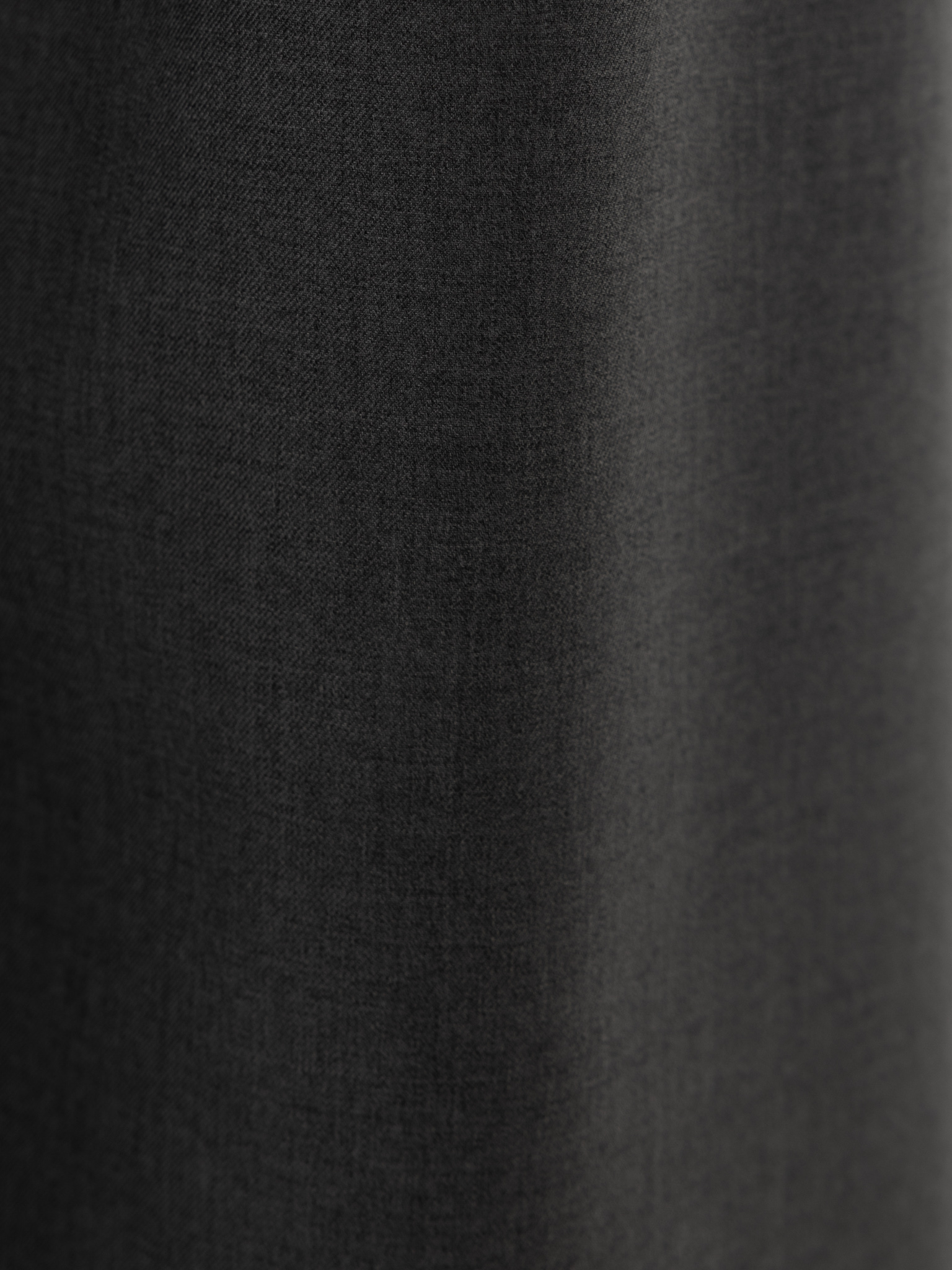 Loose-fit trousers with asymmetrical fastening