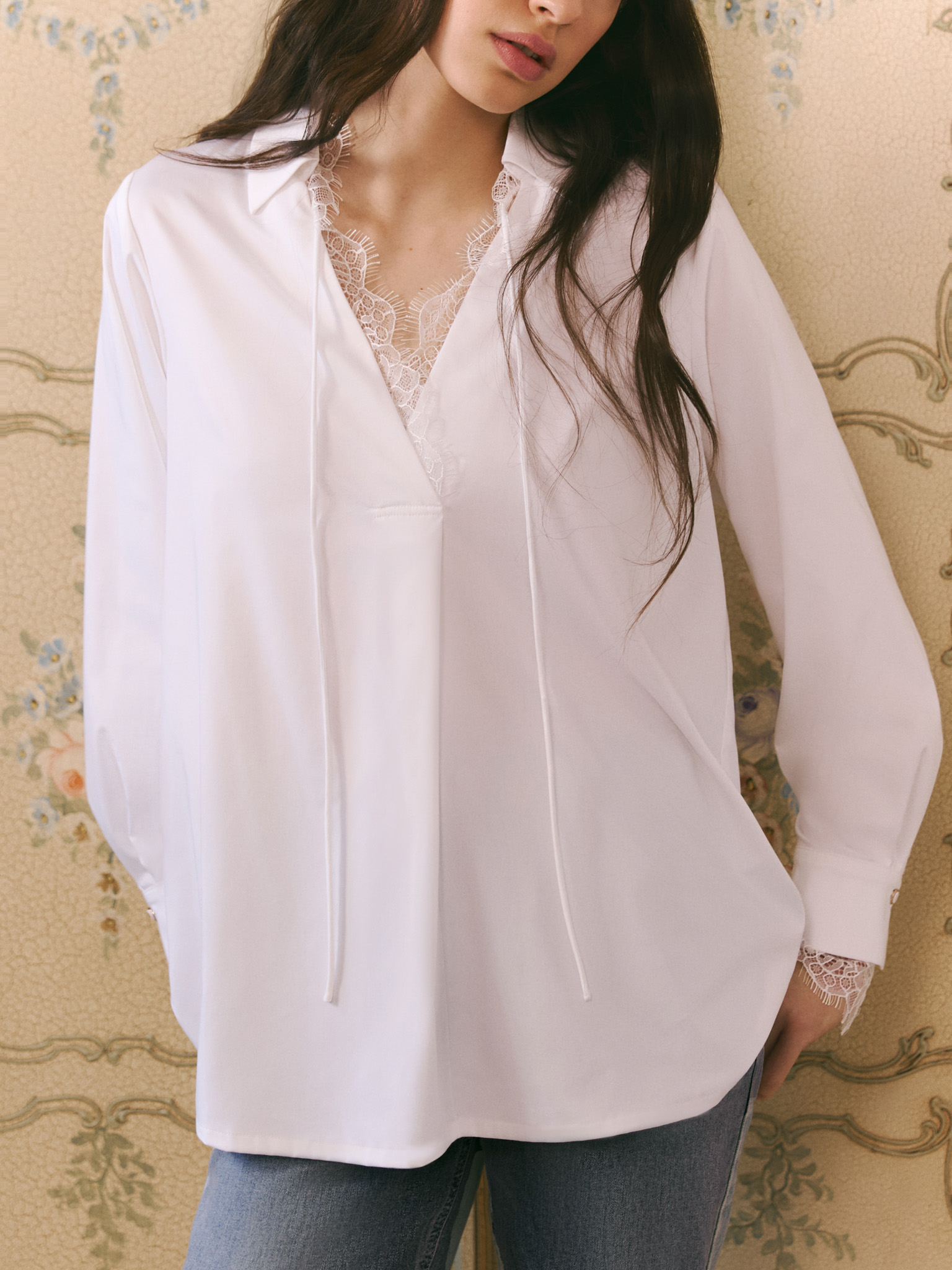 Blouse with lace trim and ties at the collar