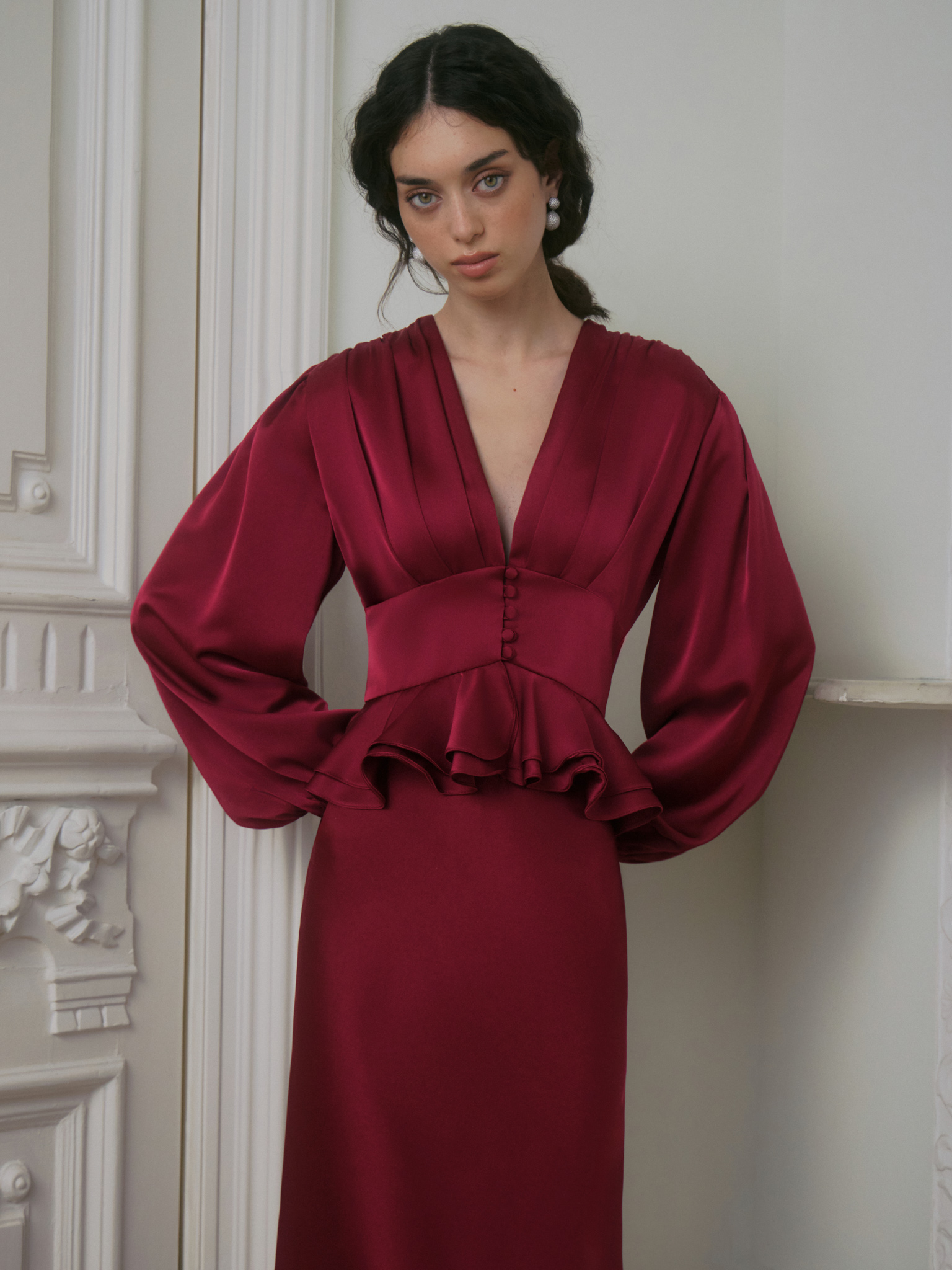 Satin midi dress with a voluminous peplum