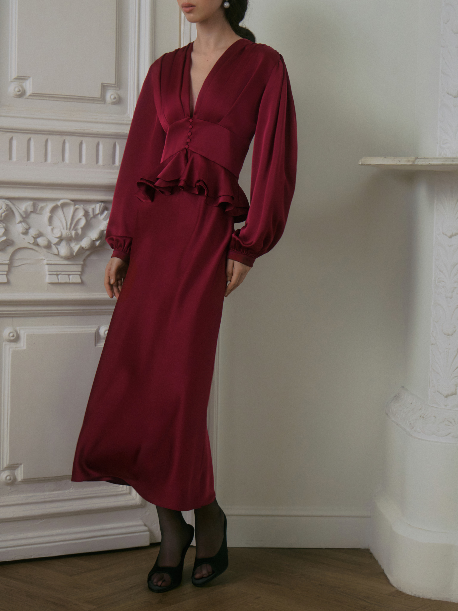 Satin midi dress with a voluminous peplum
