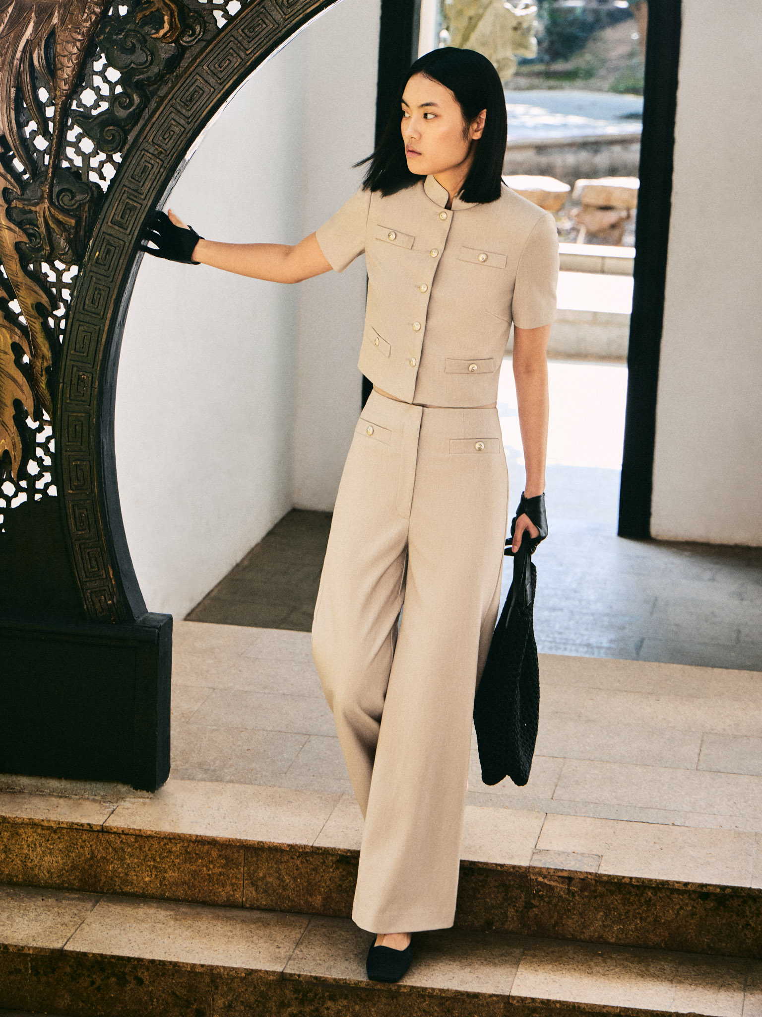 Jacket with short sleeves and oversized buttons