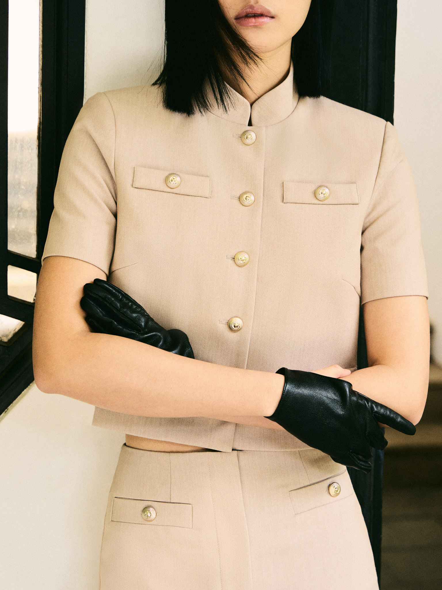 Jacket with short sleeves and oversized buttons