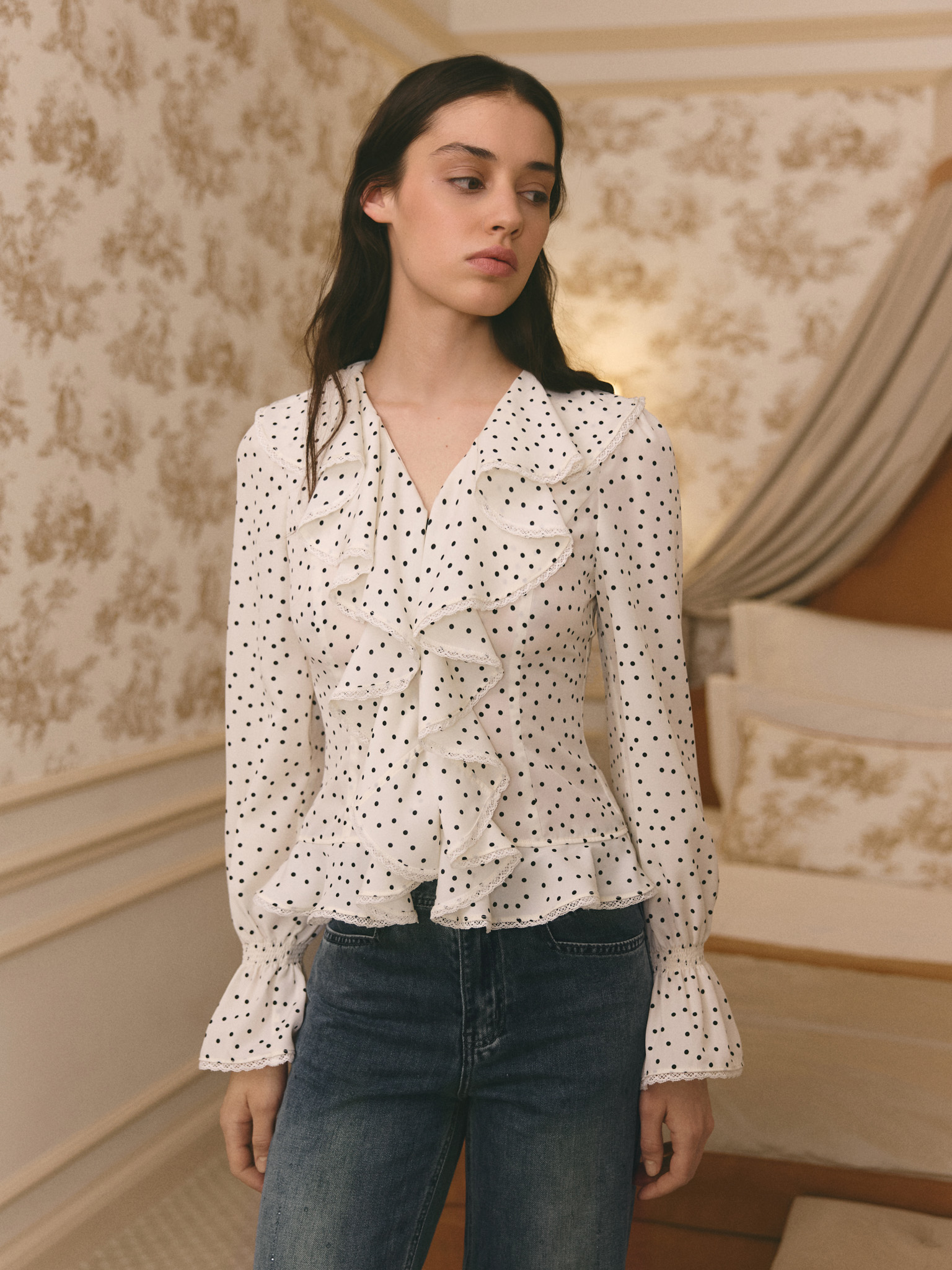 Polka dot blouse with ruffles on the collar
