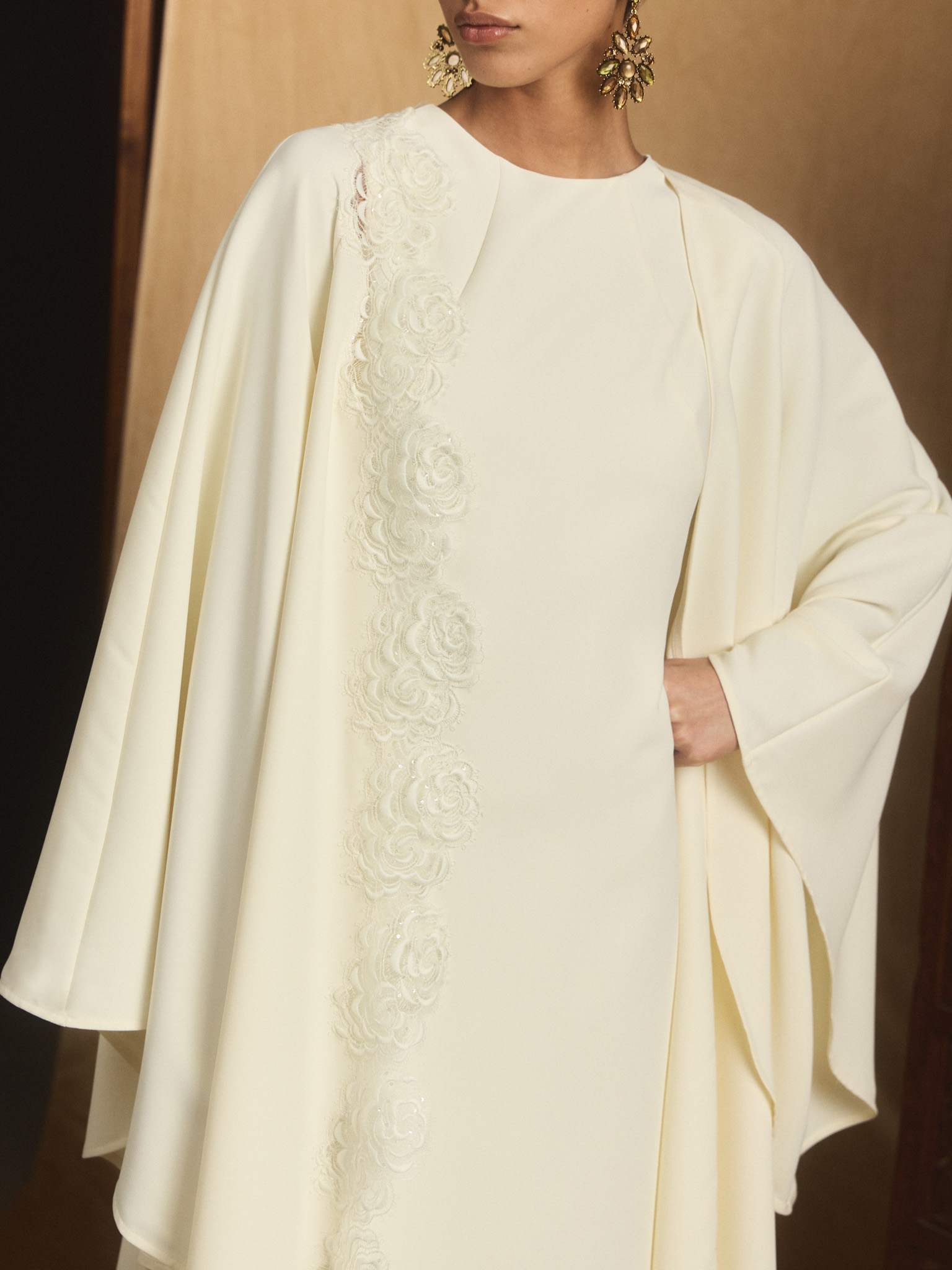 Maxi dress with voluminous cape and lace decoration