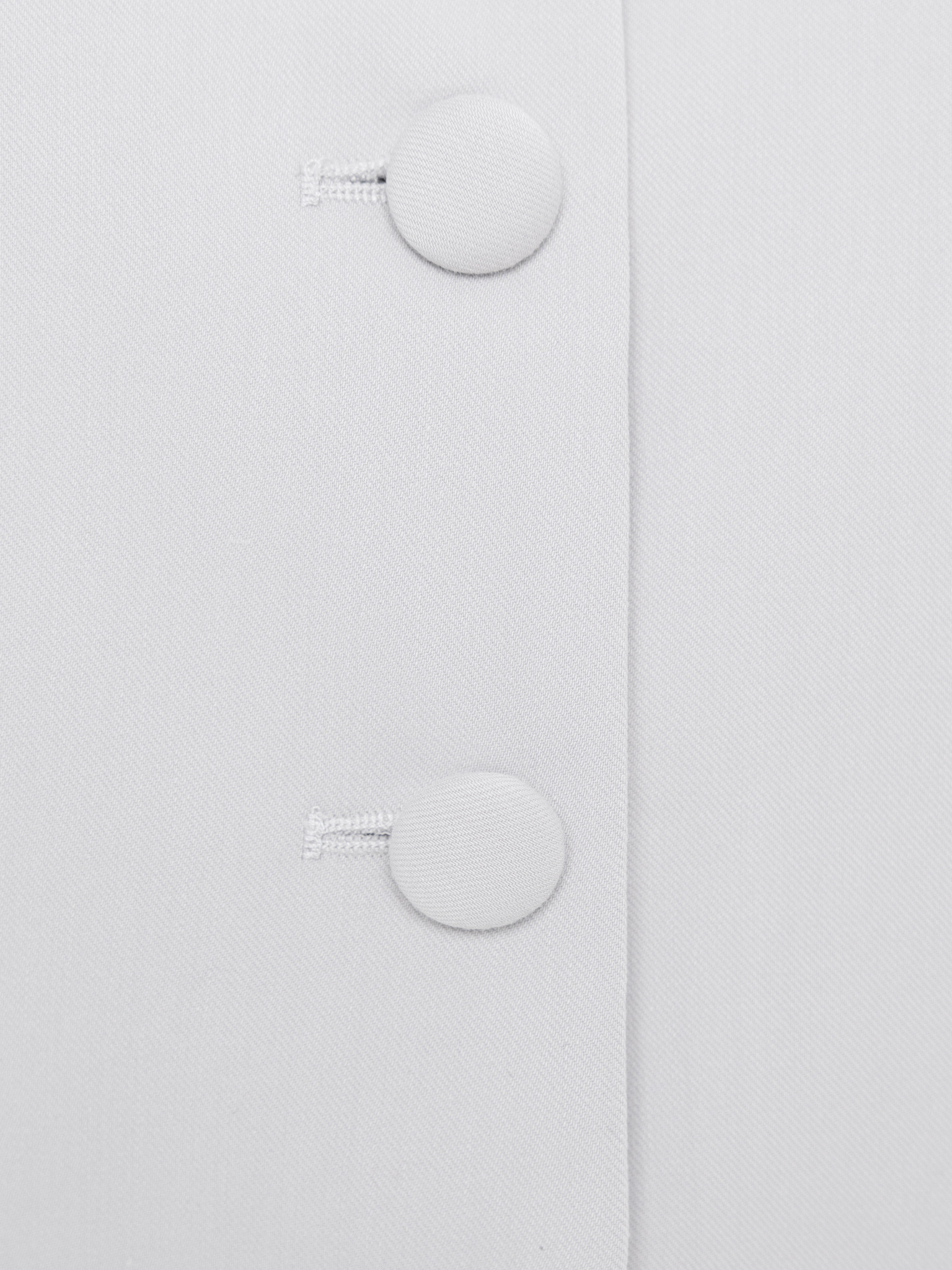 Fitted single-breasted jacket with covered buttons