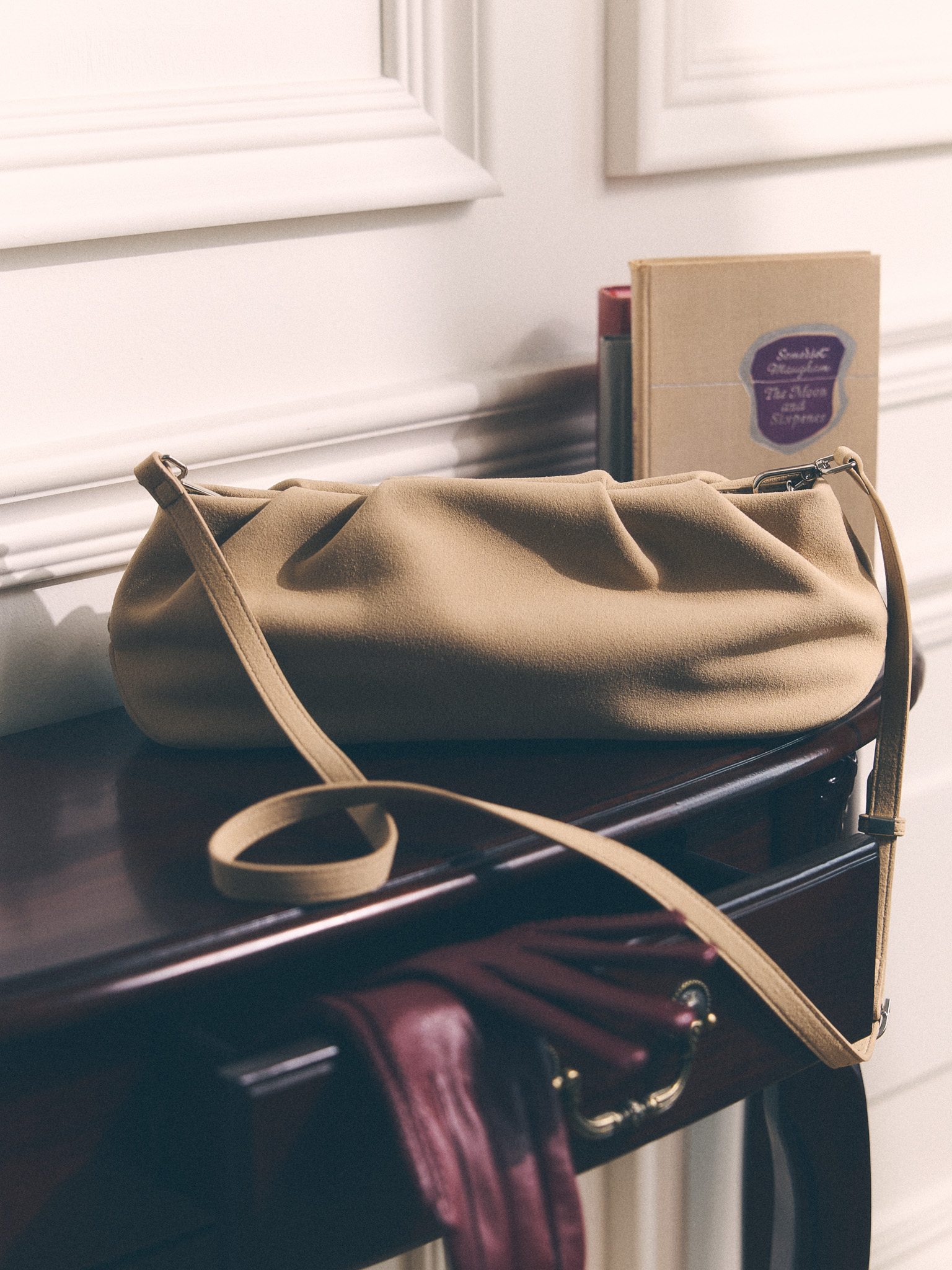 Voluminous eco-leather clutch bag with a thin strap