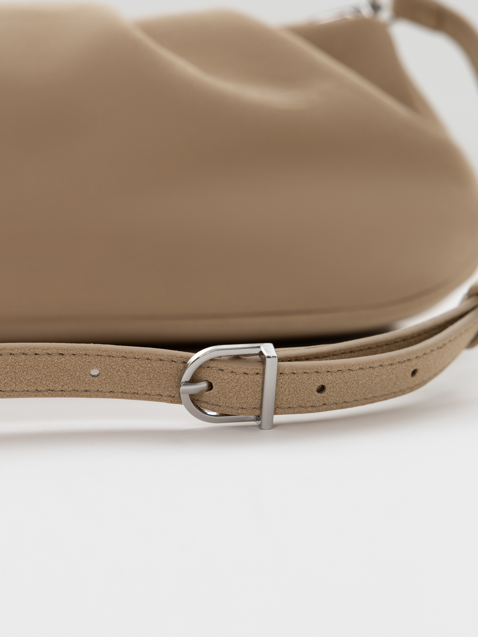 Voluminous eco-leather clutch bag with a thin strap