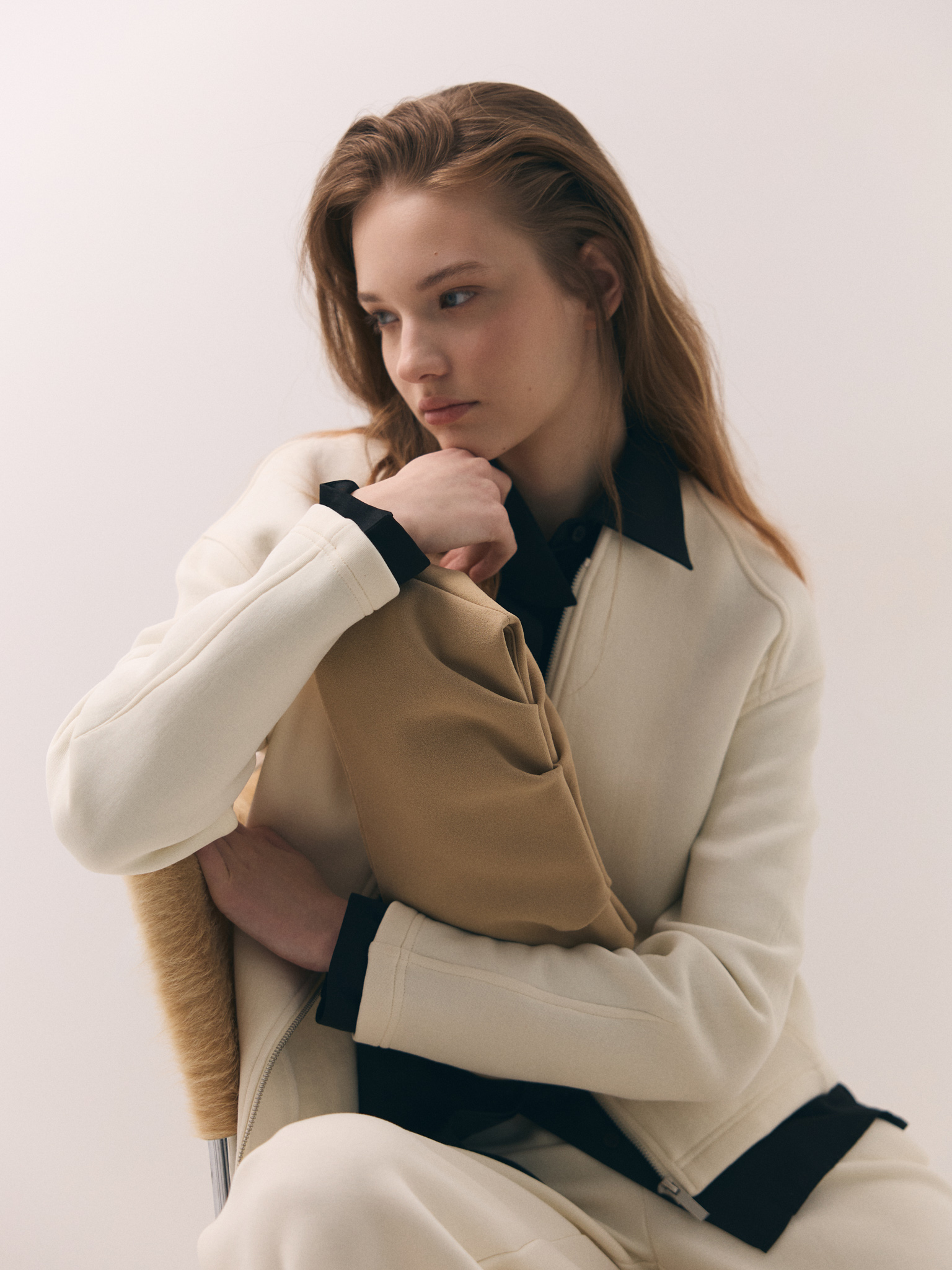 Voluminous eco-leather clutch bag with a thin strap
