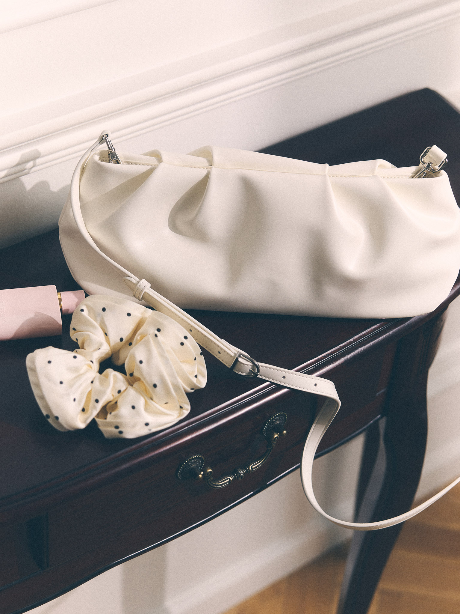 Voluminous eco-leather clutch bag with a thin strap
