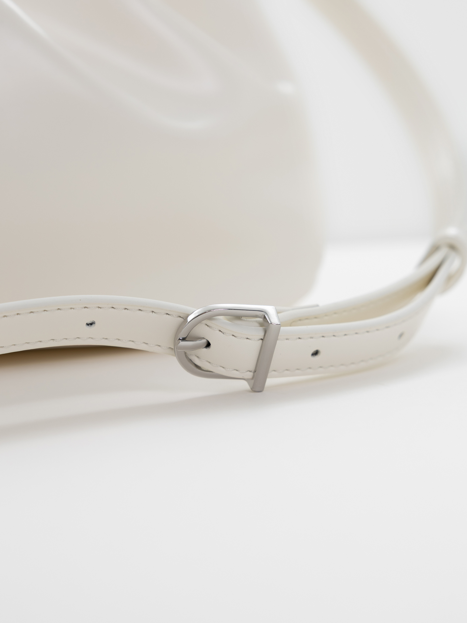 Voluminous eco-leather clutch bag with a thin strap