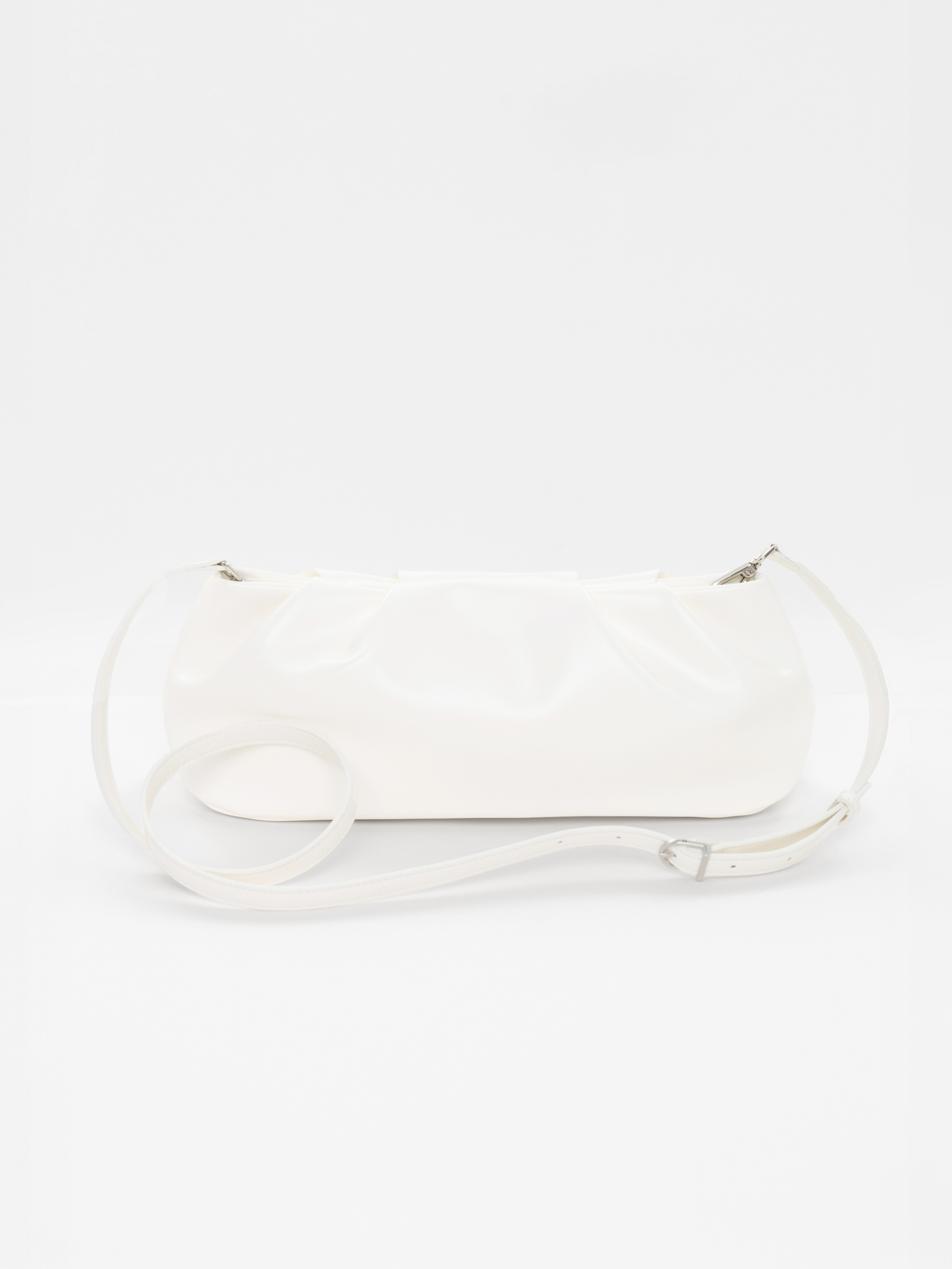 Voluminous eco-leather clutch bag with a thin strap