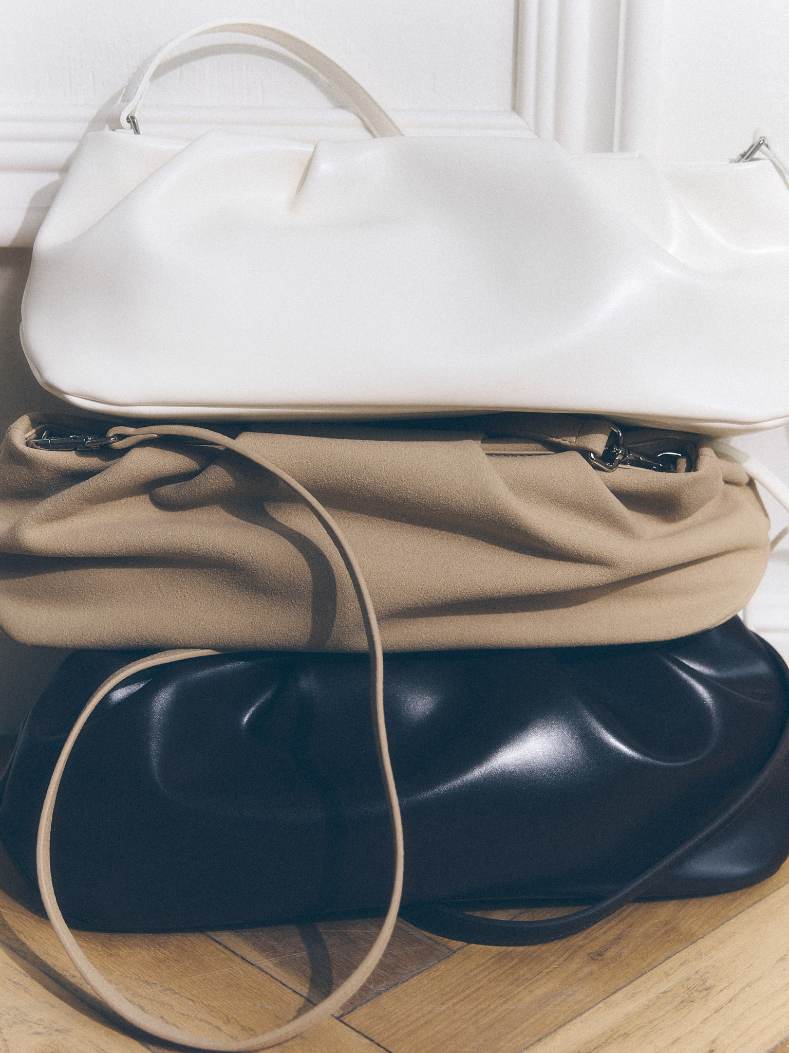 Voluminous eco-leather clutch bag with a thin strap