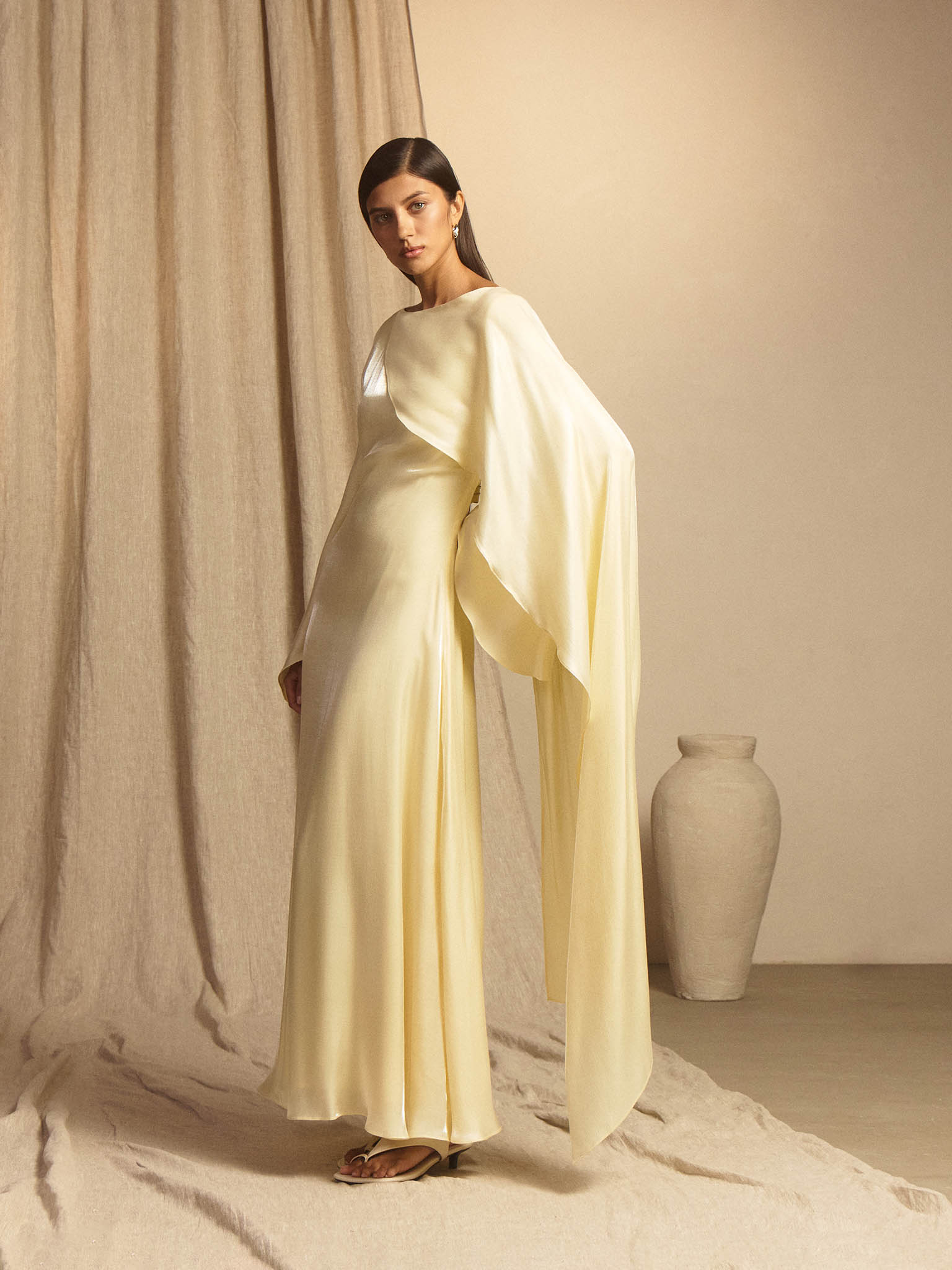 Textured maxi dress with one shoulder cape