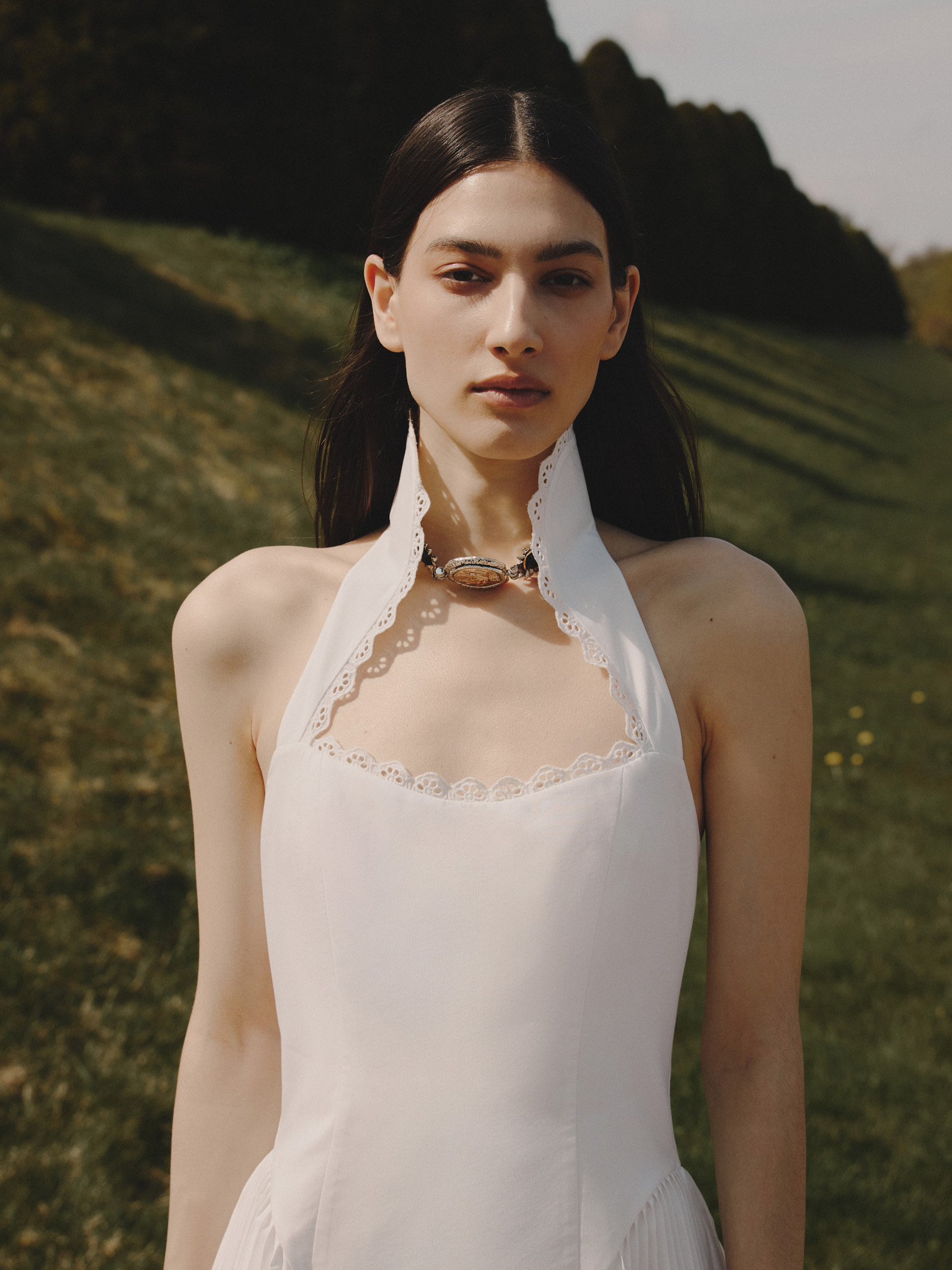Strapless mini dress with pleated inserts on the skirt