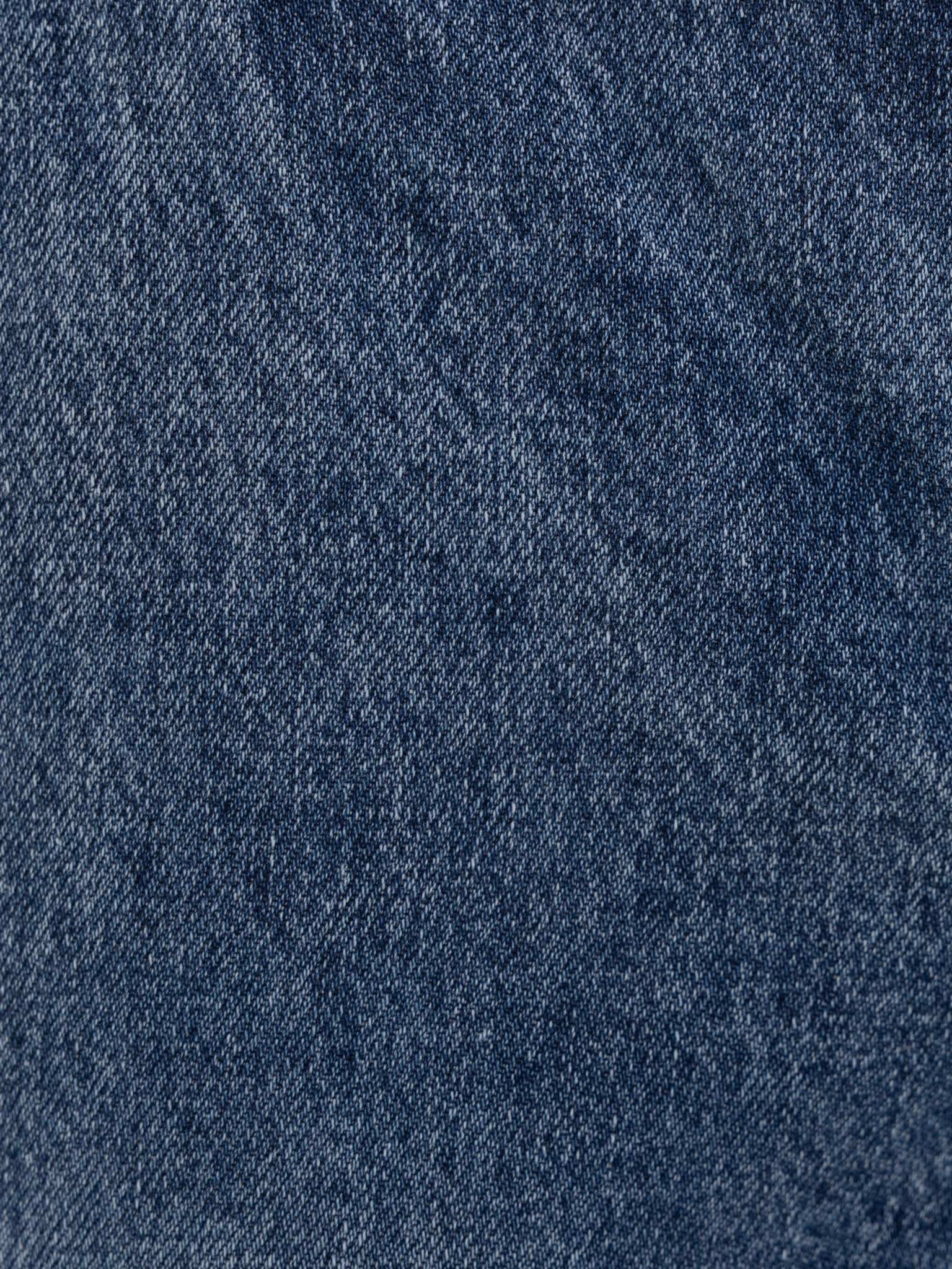 Flared denim jeans with distressed details
