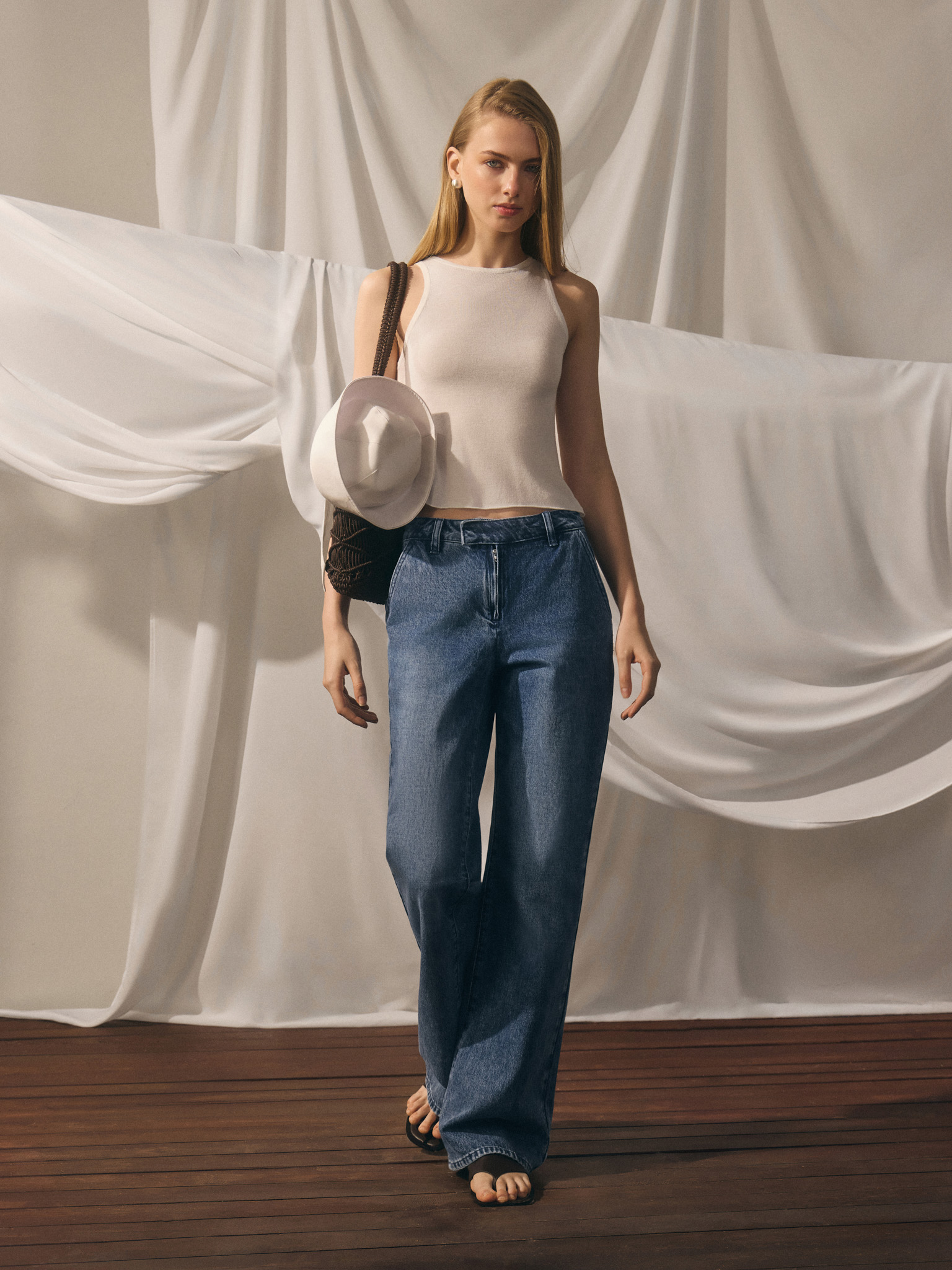 Flared denim jeans with distressed details